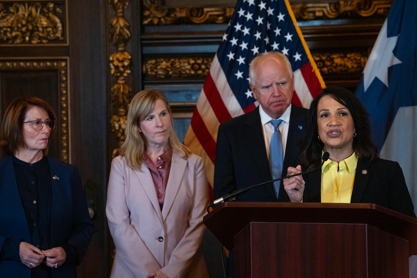 DFL Sen. Erin Murphy left, DFL Rep. Melissa Hortman and Gov. Tim Walz listen as  Speaker of the House Lisa Demuth speaks during a press conference in the governor's reception room announcing a 2-year budget deal at the Minnesota Capitol on Thursday.