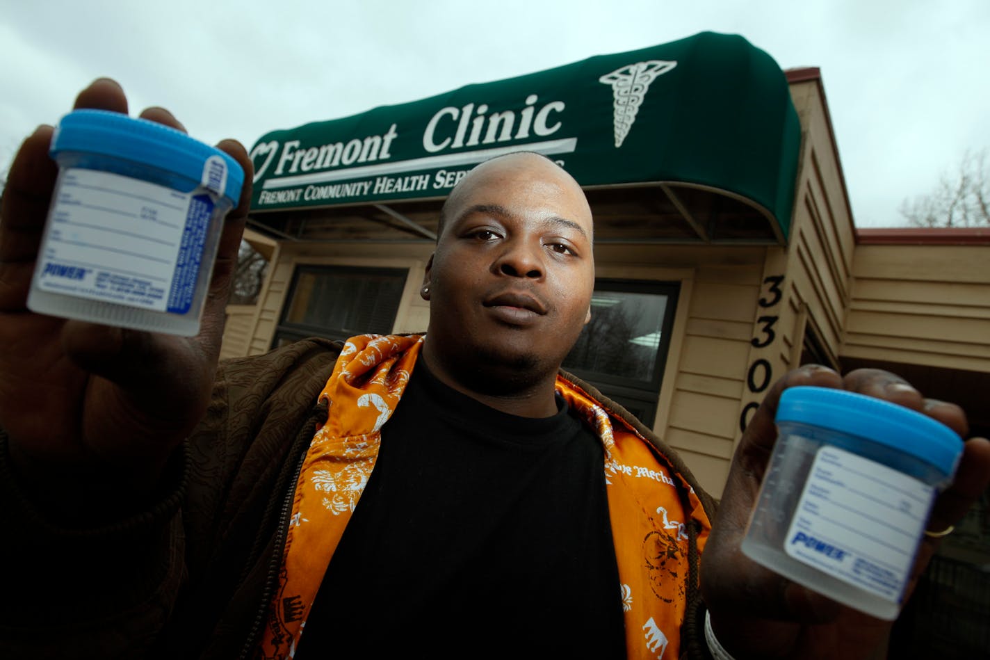Richard Tsong-Taatarii/rtsong-taatarii@startribune.com
Minneapolis, MN;3/25/08;left to right: Desmond Grady, 21, works at the Freemont Clinic to raise awareness of sexually transmitted diseases among young men. Urine collected in plastic cups like these can be indicators of STD's.