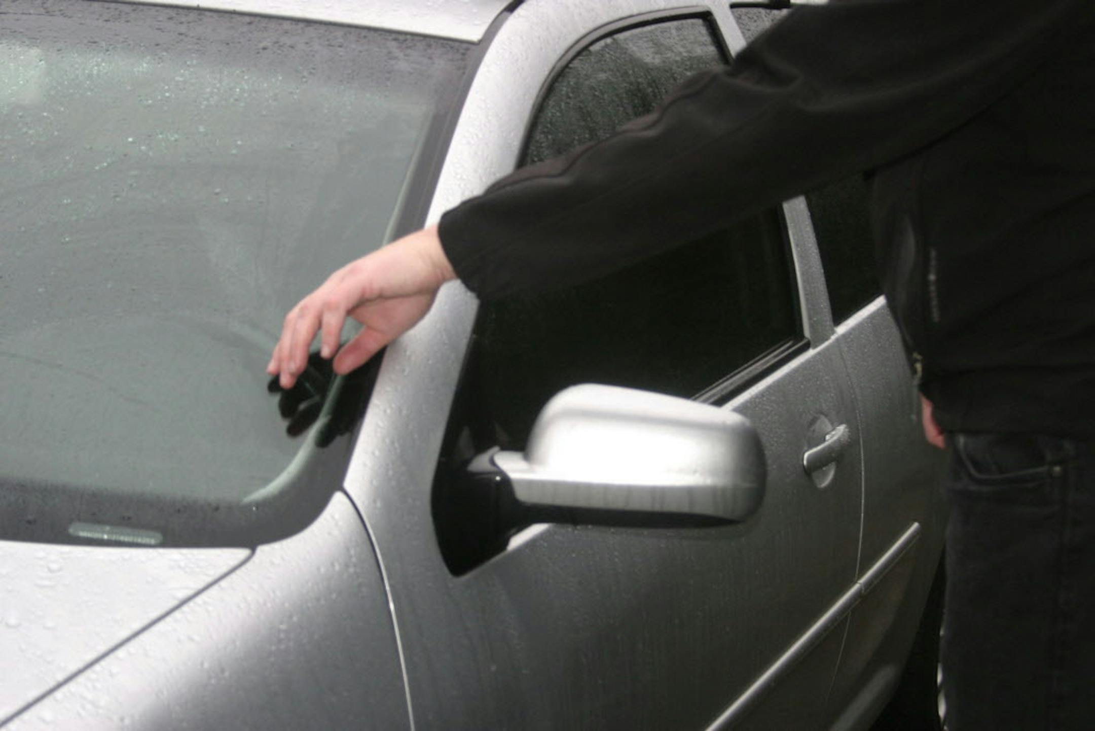 Implantable technology proponent Amal Graafstra of Seattle demonstrates how one of the doors to his car can be unlocked just by passing either of his hands past a sensor which reads the signal from a RFID chip implanted in each of his hands. The RFID chips -- each just slightly larger than the size of a grain of rice -- trigger the door locks the same as his remote fob or mechanical key would. He uses similar technology to unlock his house door as well as his cell phone, computer and a data cent