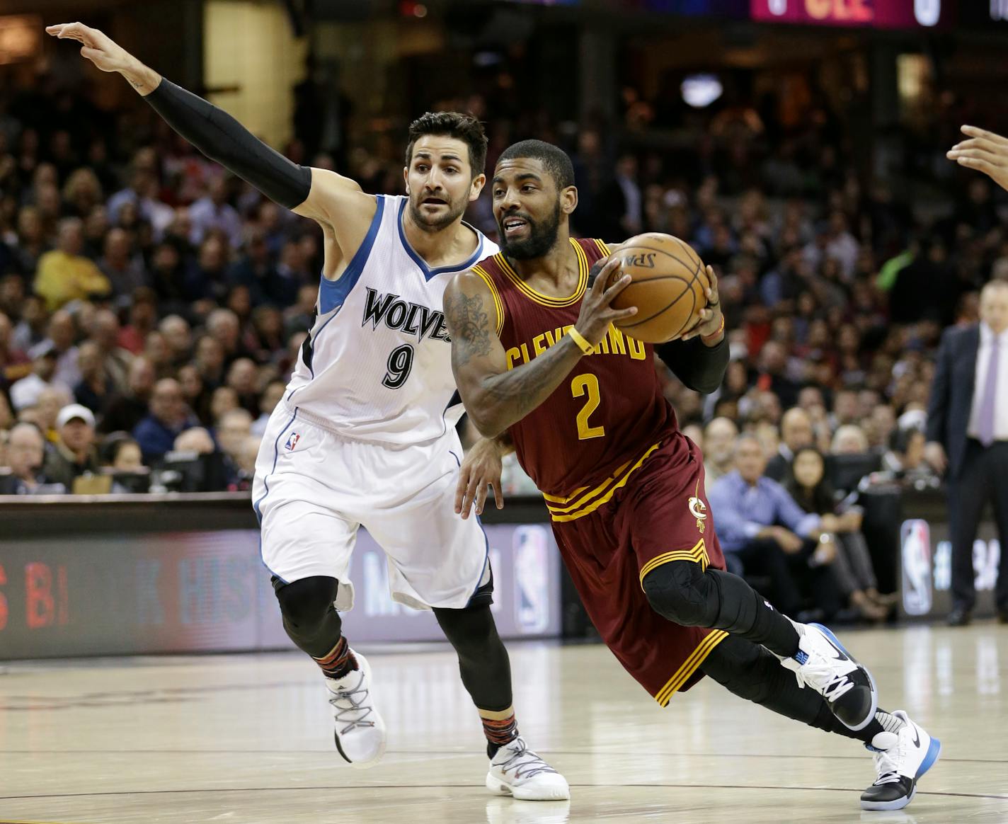 Cleveland Cavaliers' Kyrie Irving (2) drives against Minnesota Timberwolves' Ricky Rubio (9), from Spain, in the first half of an NBA basketball game, Wednesday, Feb. 1, 2017, in Cleveland. (AP Photo/Tony Dejak)