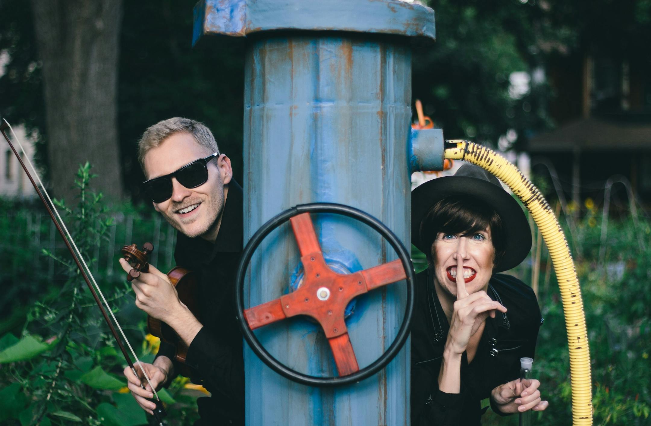 Provided photo Violinist Devan Moran and Lauren Drasler perform in ìAgent Fidelio: A Picnic Operetta,î the 5th annual production for the Mixed Precipitation performance company, which is touring the show throughout the Twin Cities area in August and September.