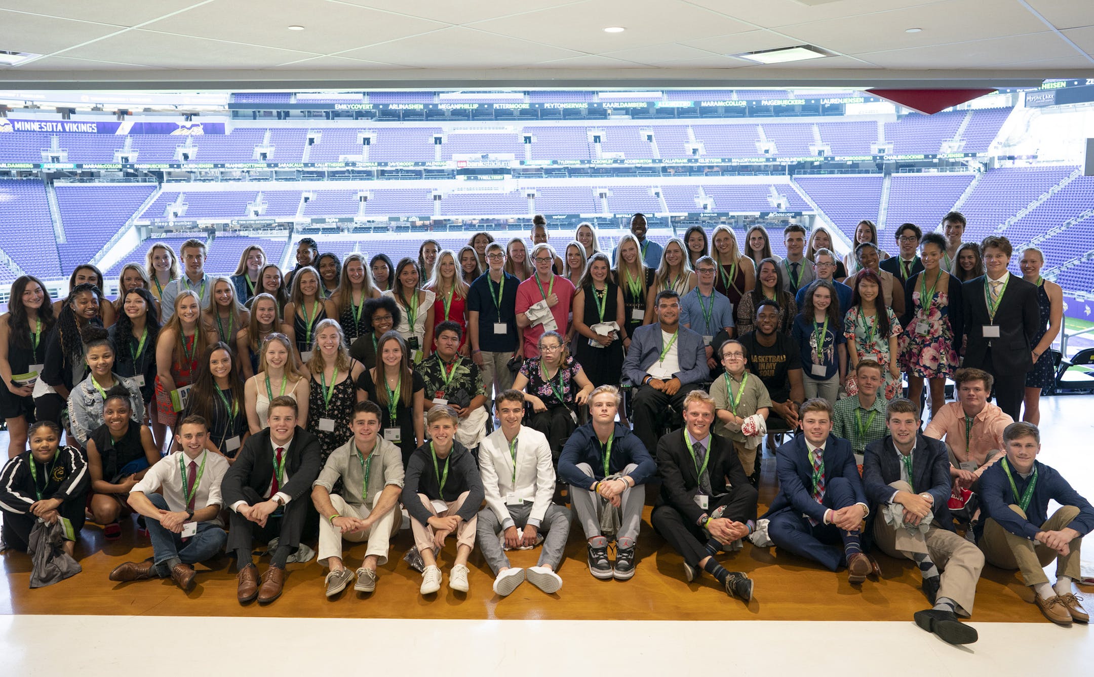 The honored athletes gathered around former Benilde-St. Margaret's hockey player Jack Jablonski and the Timberwolves' Josh Okogie before the banquet to honor the winners of the Star Tribune All-Metro Sports Awards.