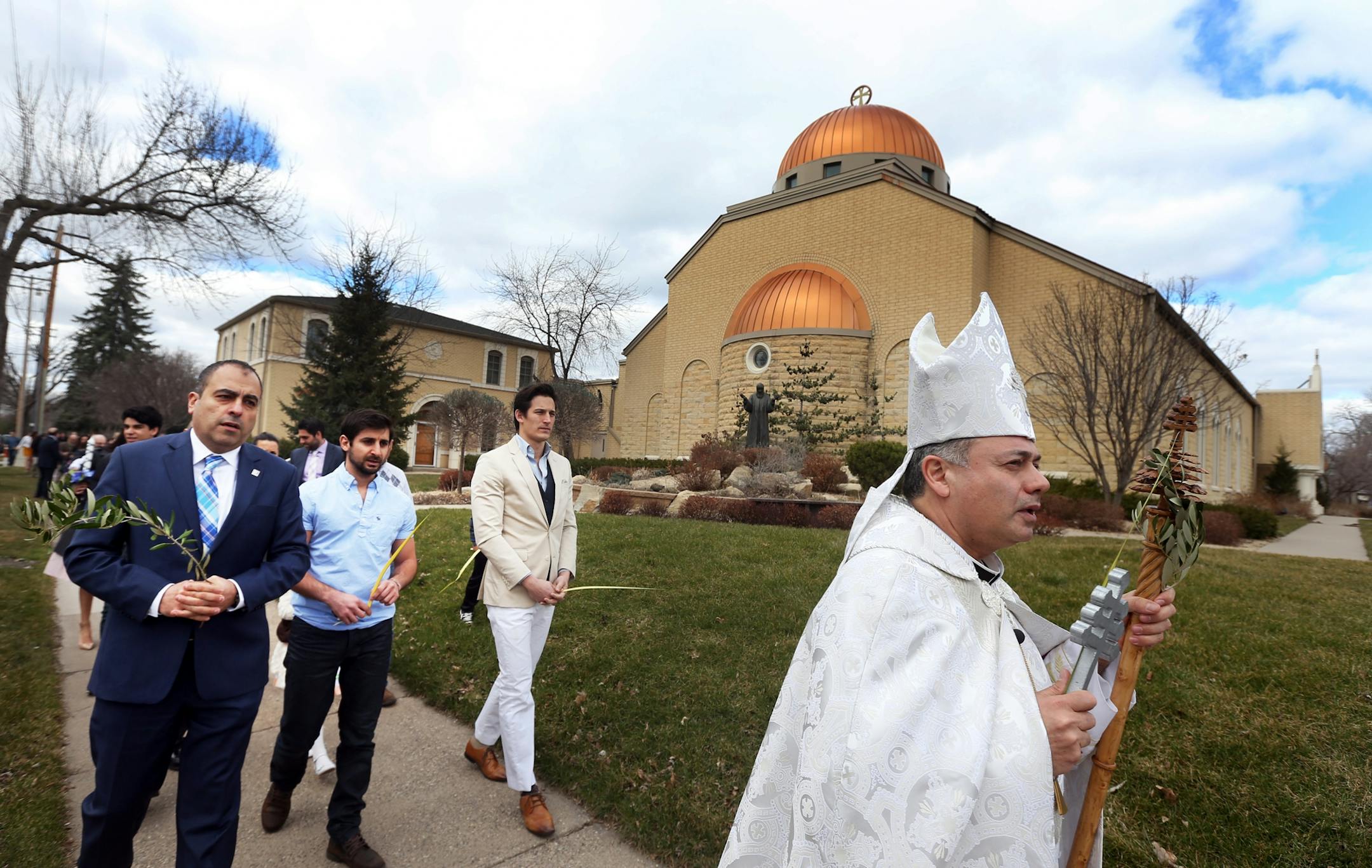 Pastor Sharbel-Ghattas Maroun led a procession around the church after Palm Sunday at Maron's Catholic Church March 20, 2016 in Minneapolis, MN.