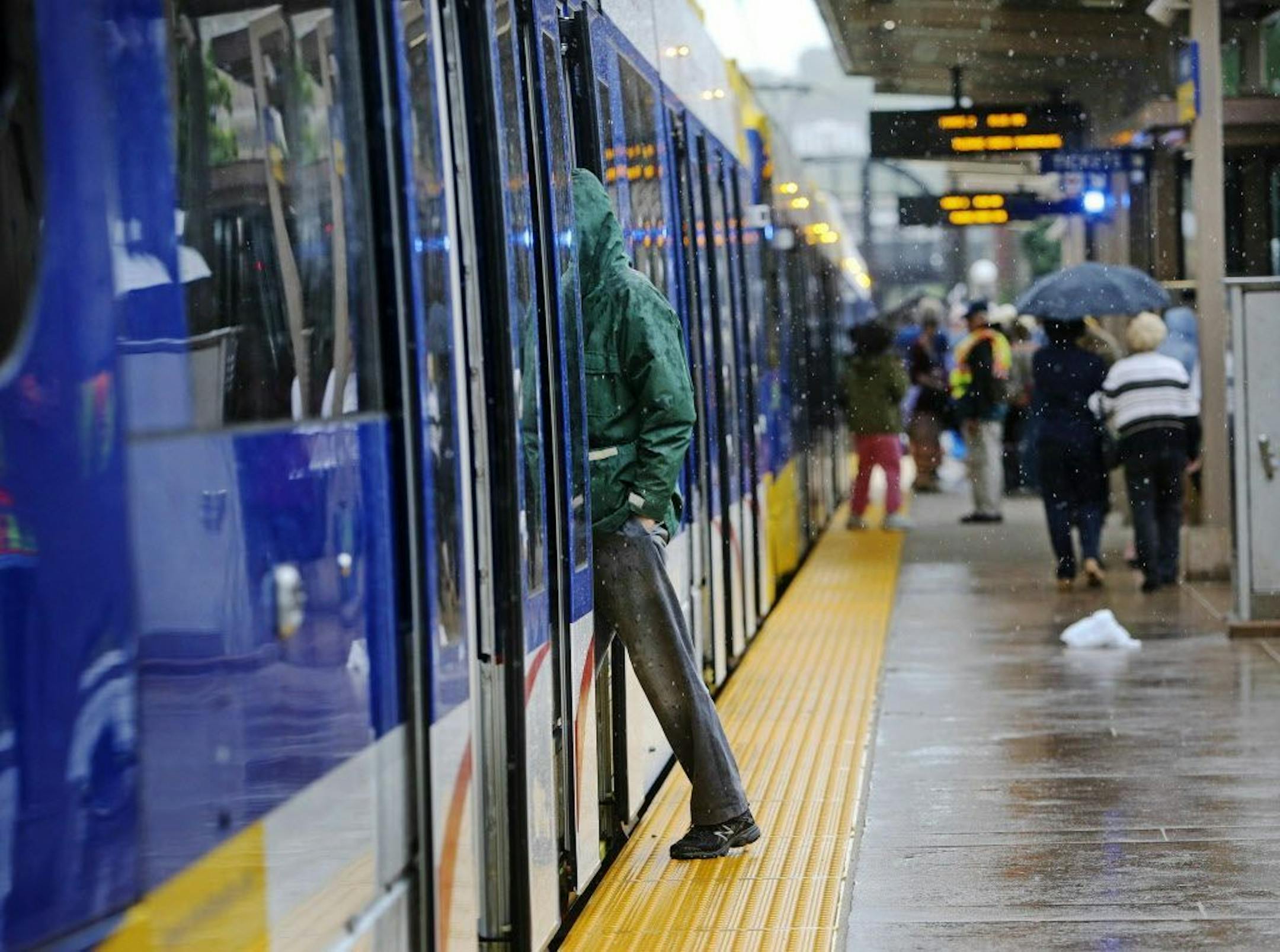 Riders prepare to board the Green Line.