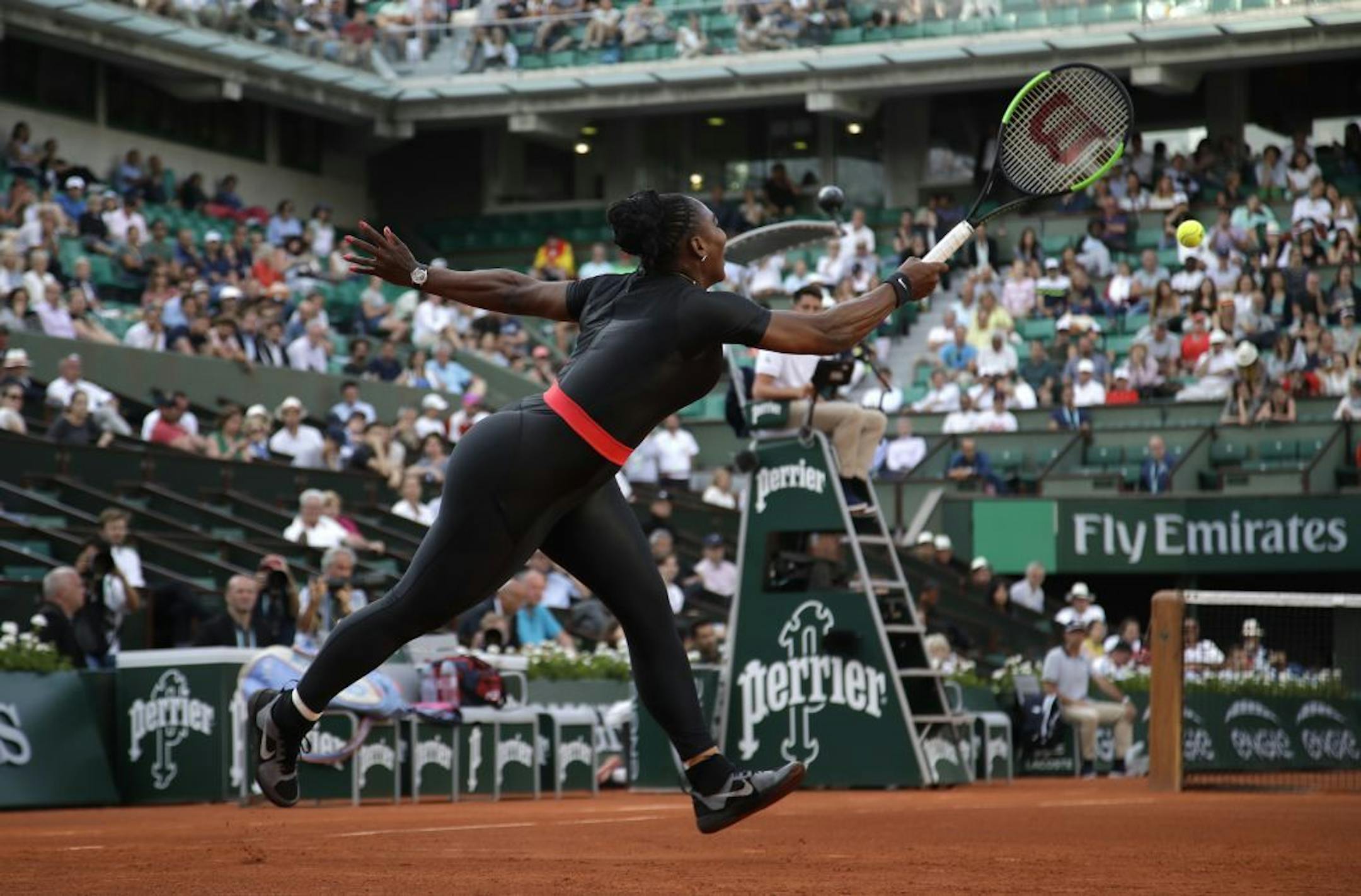 Serena Williams of the U.S. returns the ball to Australia's Ashleigh Barty during their second round match of the French Open tennis tournament at the Roland Garros stadium, Thursday, May 31, 2018 in Paris.
