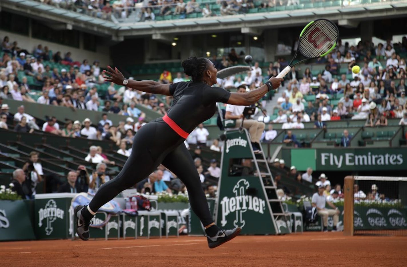 Serena Williams of the U.S. returns the ball to Australia's Ashleigh Barty during their second round match of the French Open tennis tournament at the Roland Garros stadium, Thursday, May 31, 2018 in Paris.