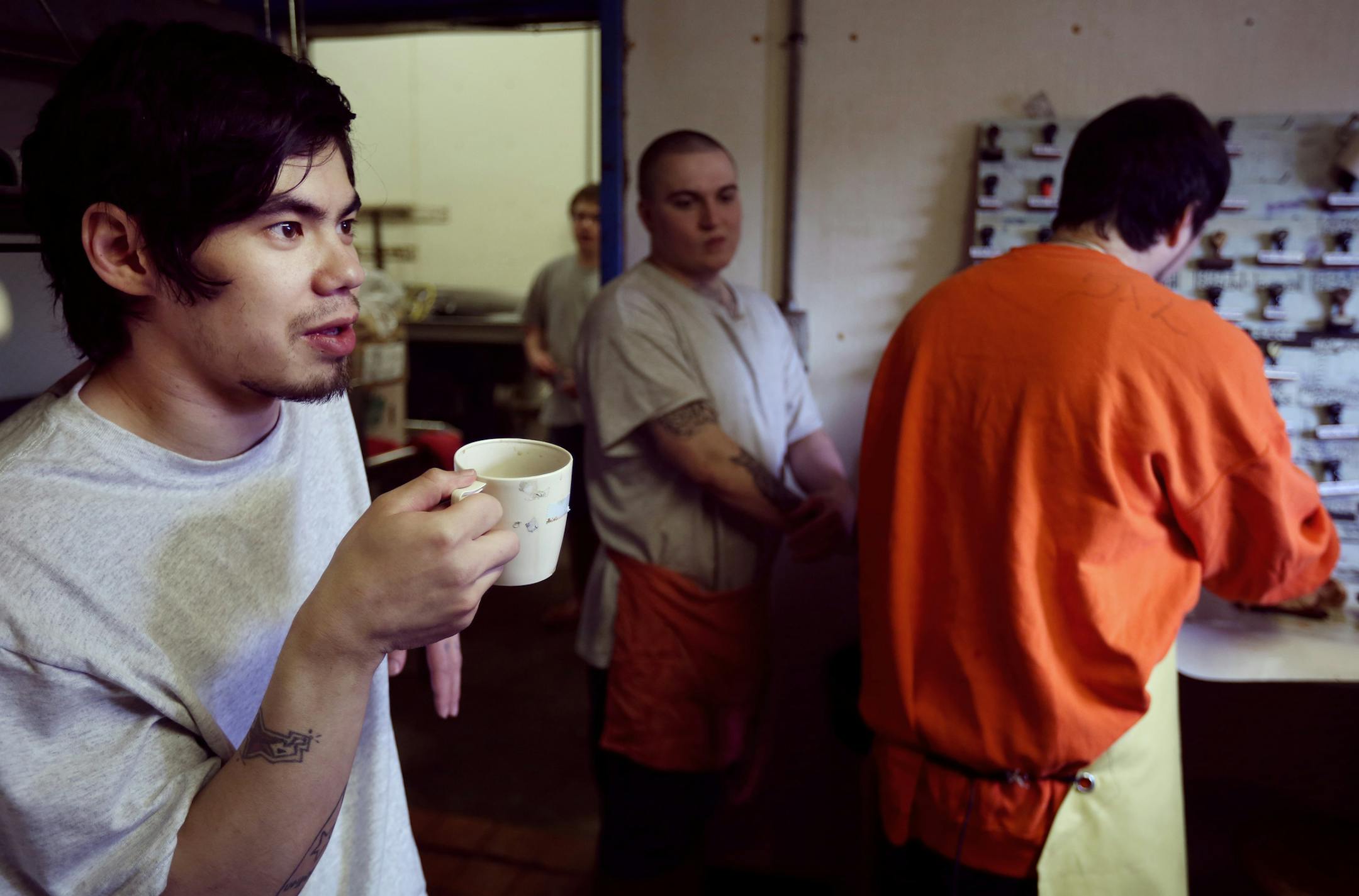 Jake Truong enjoyed and cup of coffee and fresh roast chicken during his break. Inmates at the Northeast Regional Corrections Center butcher chickens and pigs mostly to eat later in the week for lunch. A few lawmakers want to turn that loose program into a certification-granting curriculum with the idea that it will help the men get jobs and, more broadly, respond to a shortage of butchers. ] Wednesday March 25, 2015 in Saginaw, Minnesota. ] Jerry Holt/ Jerry.Holt@Startribune.com
