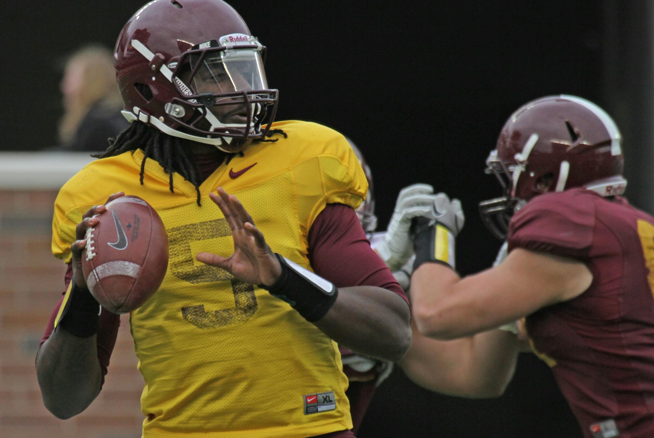 Maroon Roster Quarterback MarQueis Gray looked to pass as the Gophers wrapped up spring football practice with the spring game at TCF Bank Stadium on 4/21/12.