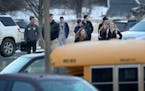 Orono High School students arrive for the day Thursday, Feb. 22, 2018, a day after a threat was posted, causing the school to go on lockdown. A studen