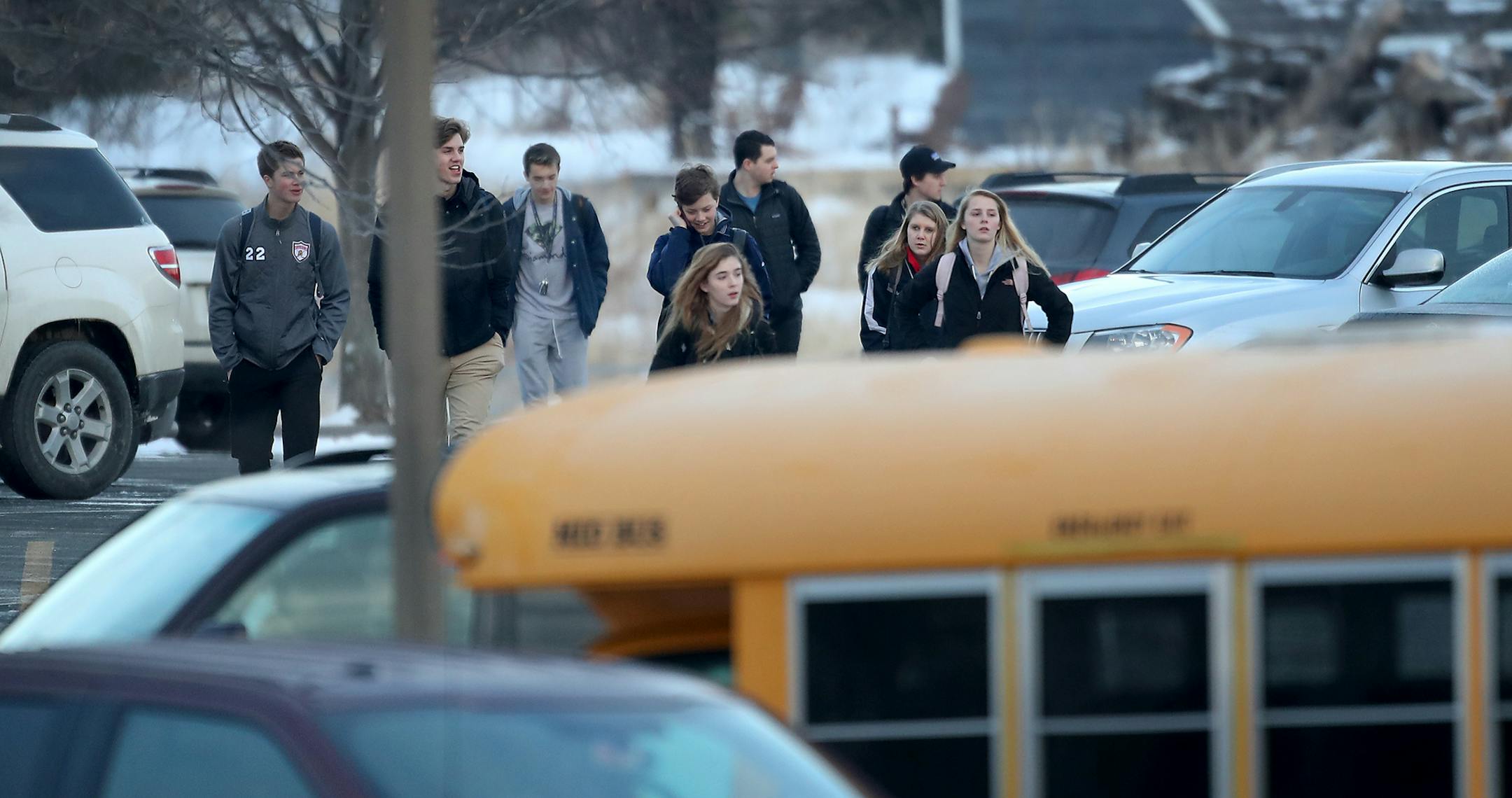 Orono High School students arrive for the day Thursday, Feb. 22, 2018, a day after a threat was posted, causing the school to go on lockdown. A student was arrested at the high school Wednesday after a threat of gun violence. ] DAVID JOLES ï david.joles@startribune.com Students, parents, buses arrive at Orono schools campus starting about 7:25 a.m.