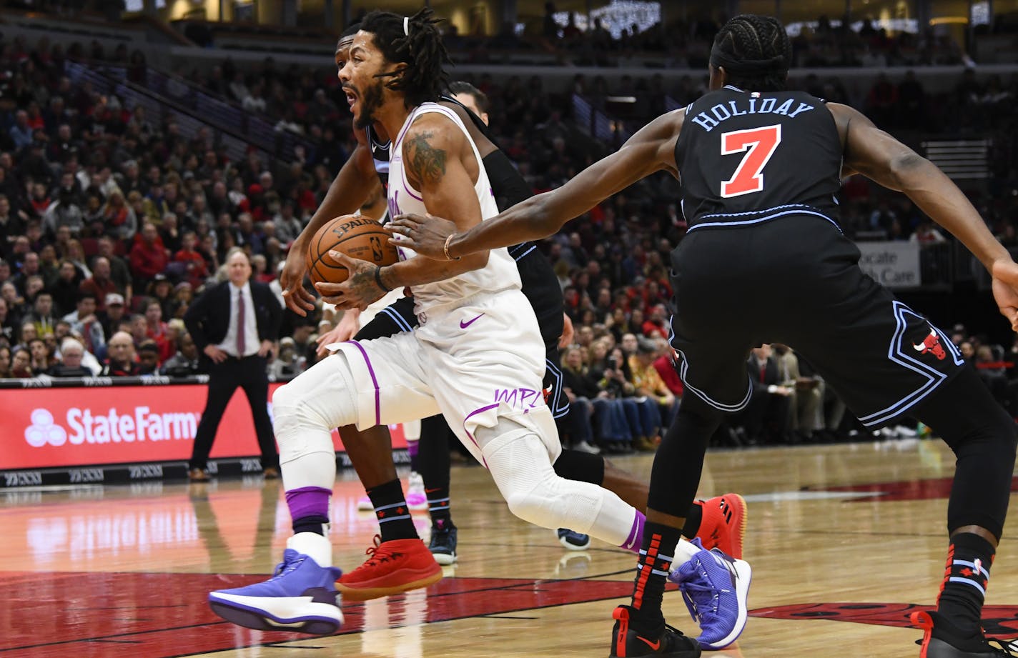 Wolves guard Derrick Rose, in his return to Chicago, drove past Bulls forward Justin Holiday. He scored a team-high 24 points as the Wolves hammered the Bulls 119-94 on Wednesday night.