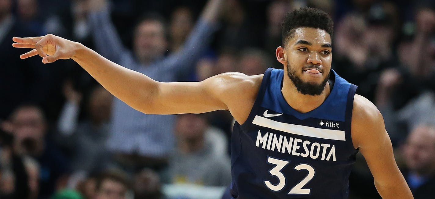 Minnesota Timberwolves center Karl-Anthony Towns (32) celebrated a 3-point shot over Golden State Warriors center Zaza Pachulia (27) at Target Center Sunday March 11, 2018 in Minneapolis, MN.] The Minnesota Timberwolves beat the Golden State Warriors 109-103 at Target Center . JERRY HOLT &#xd4; jerry.holt@startribune.com ORG XMIT: MIN1803111723047545 ORG XMIT: MIN1806281744550061