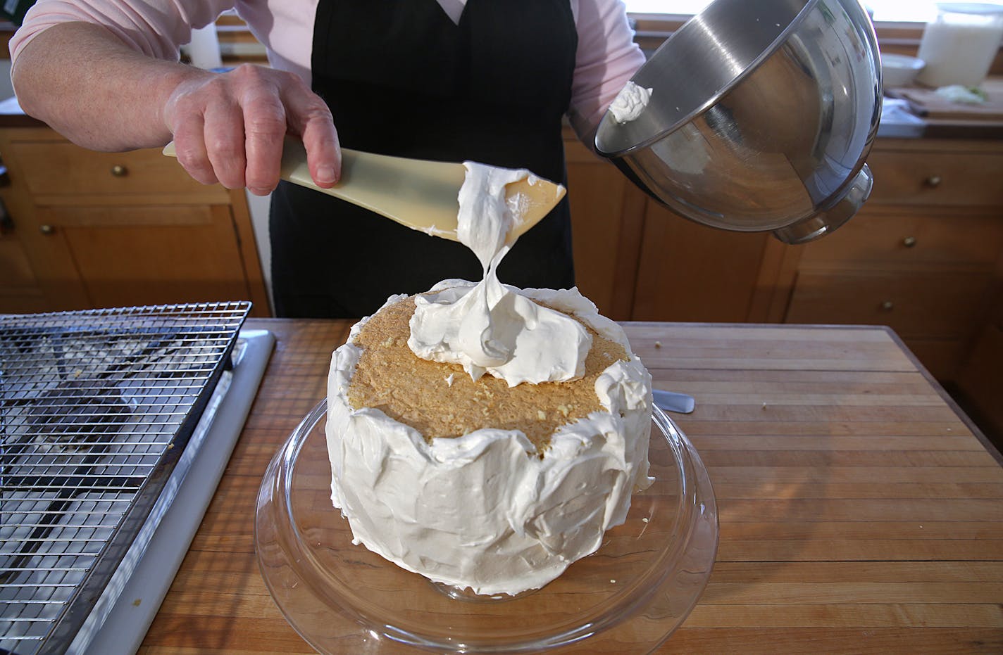 Coconut cake.] JIM GEHRZ &#x201a;&#xc4;&#xa2; jgehrz@startribune.com / Minneapolis, MN / April 4, 2014 / 1:00 PM BACKGROUND INFORMATION: Reporter Kim Ode bakes a coconut cake for Baking Central, complete with step-by-step photos showing the making of batter and custard, assembling and decorating.