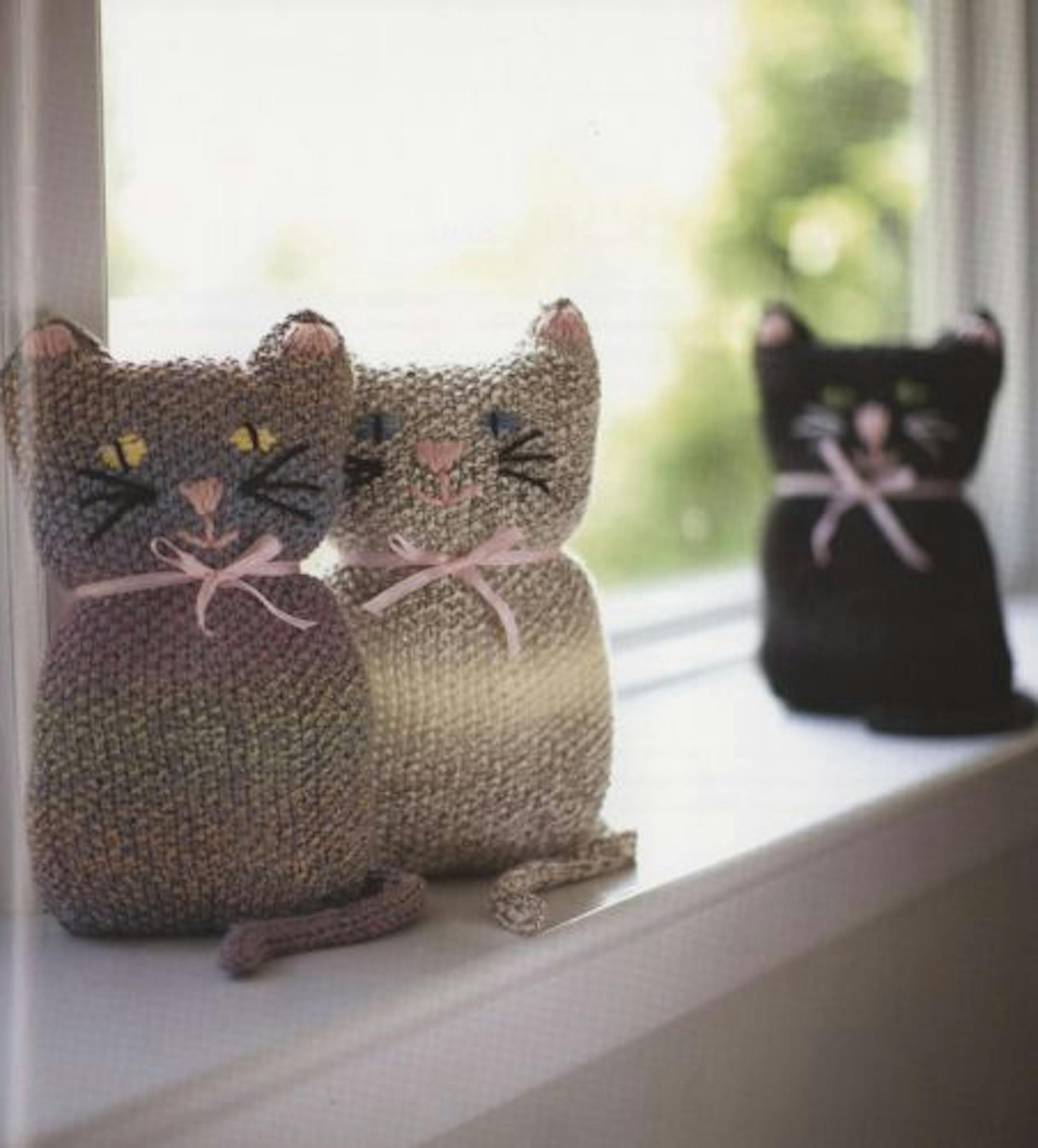 The 3 Kittens Needle Arts store, pattern for "Three Cozy Kittens," easy stuffed dolls with whimsical whiskers.