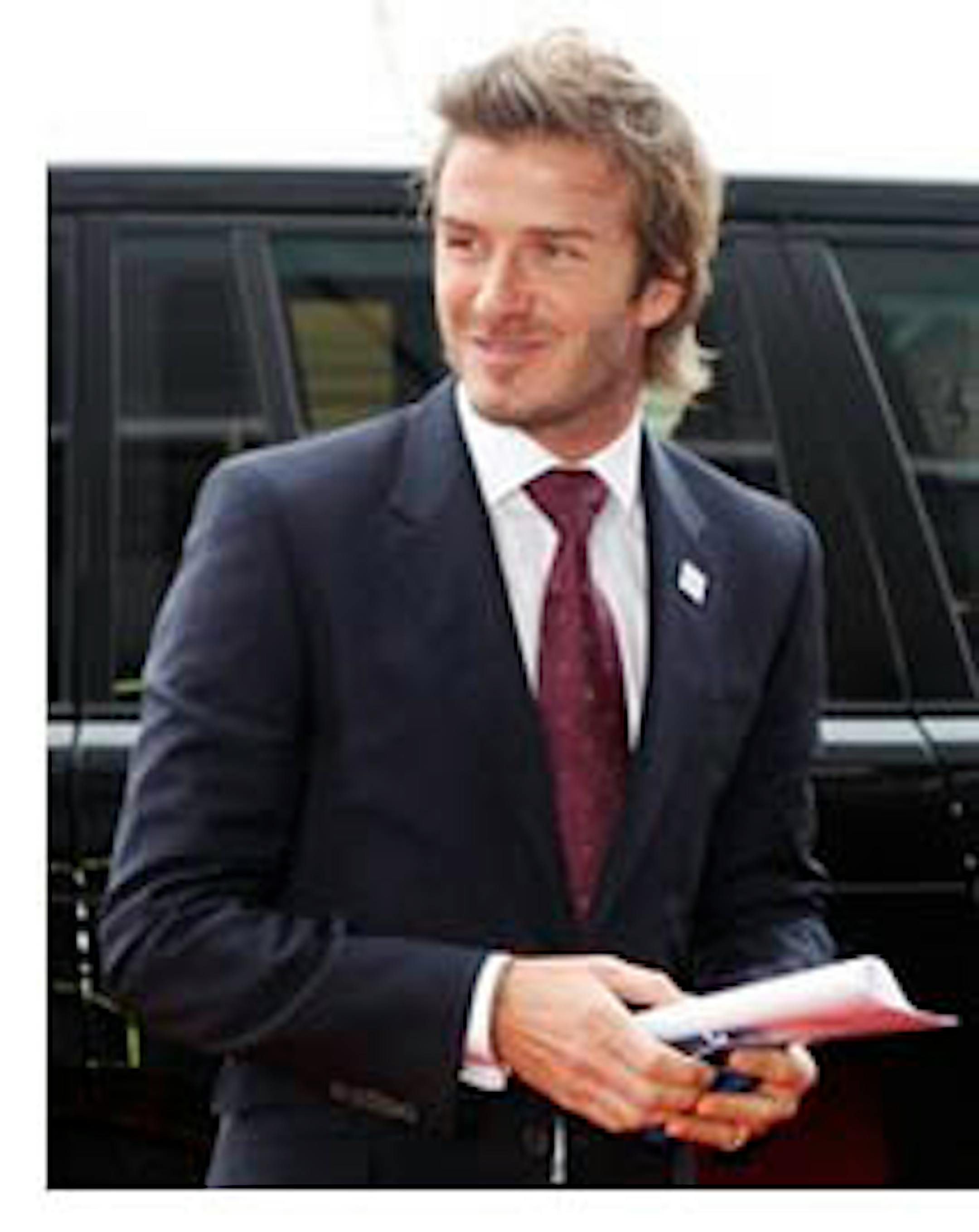 FILE - In this Dec. 2, 2010 file photo, English soccer player David Beckham arrives at the FIFA headquarters in Zurich, Switzerland. A federal judge has dismissed David Beckham's libel and slander lawsuit against "In Touch" magazine, Monday, Feb. 14, 2011, which claimed he cheated on his wife with a prostitute. The soccer star's attorney is vowing to appeal the ruling and fight to prove the allegations are false. (AP Photo/Michael Probst, file)