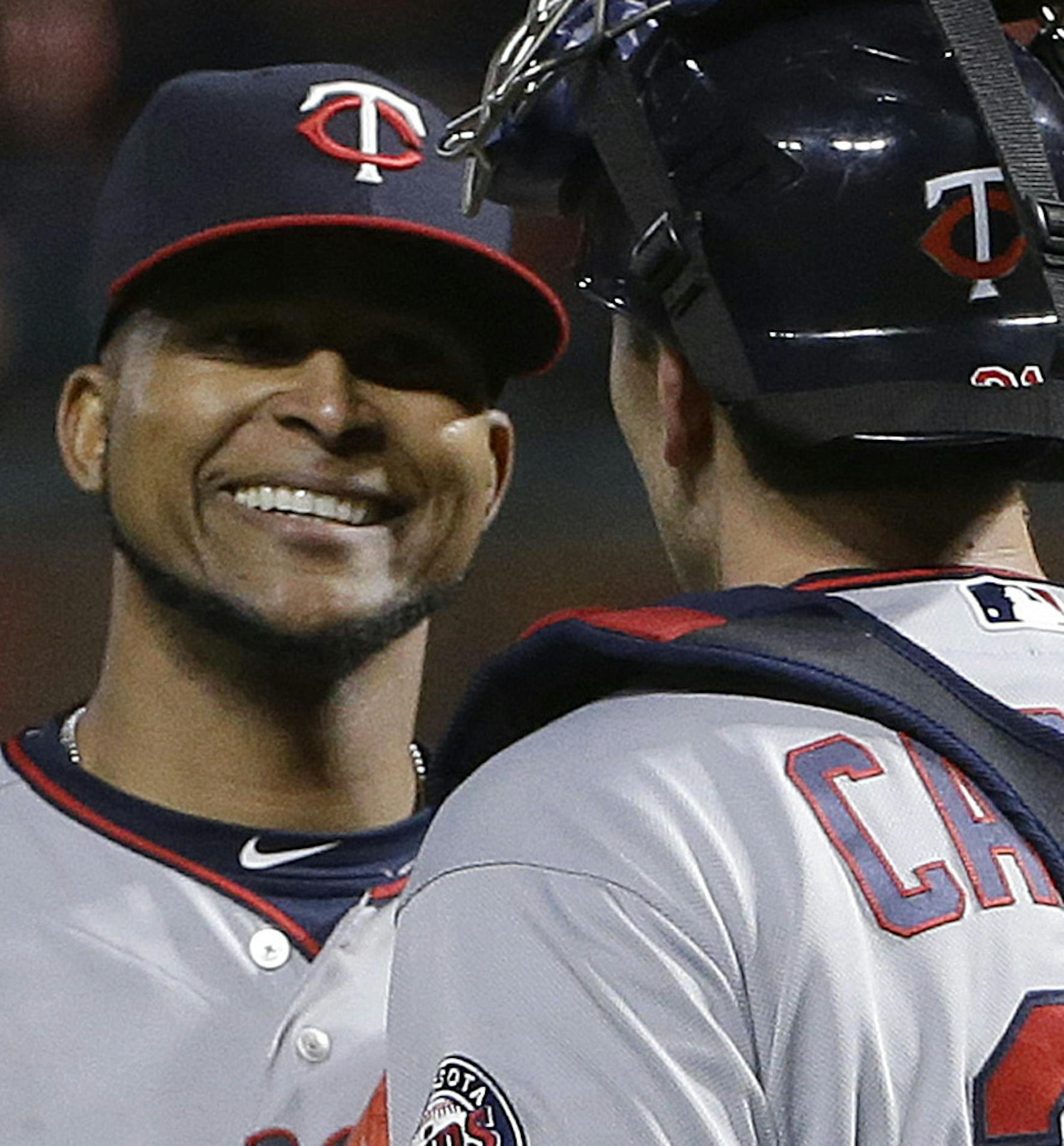 Minnesota Twins pitcher Ervin Santana, left, and catcher Jason Castro celebrate after a baseball game against the San Francisco Giants in San Francisco, Friday, June 9, 2017. The Twins won 4-0. (AP Photo/Jeff Chiu)