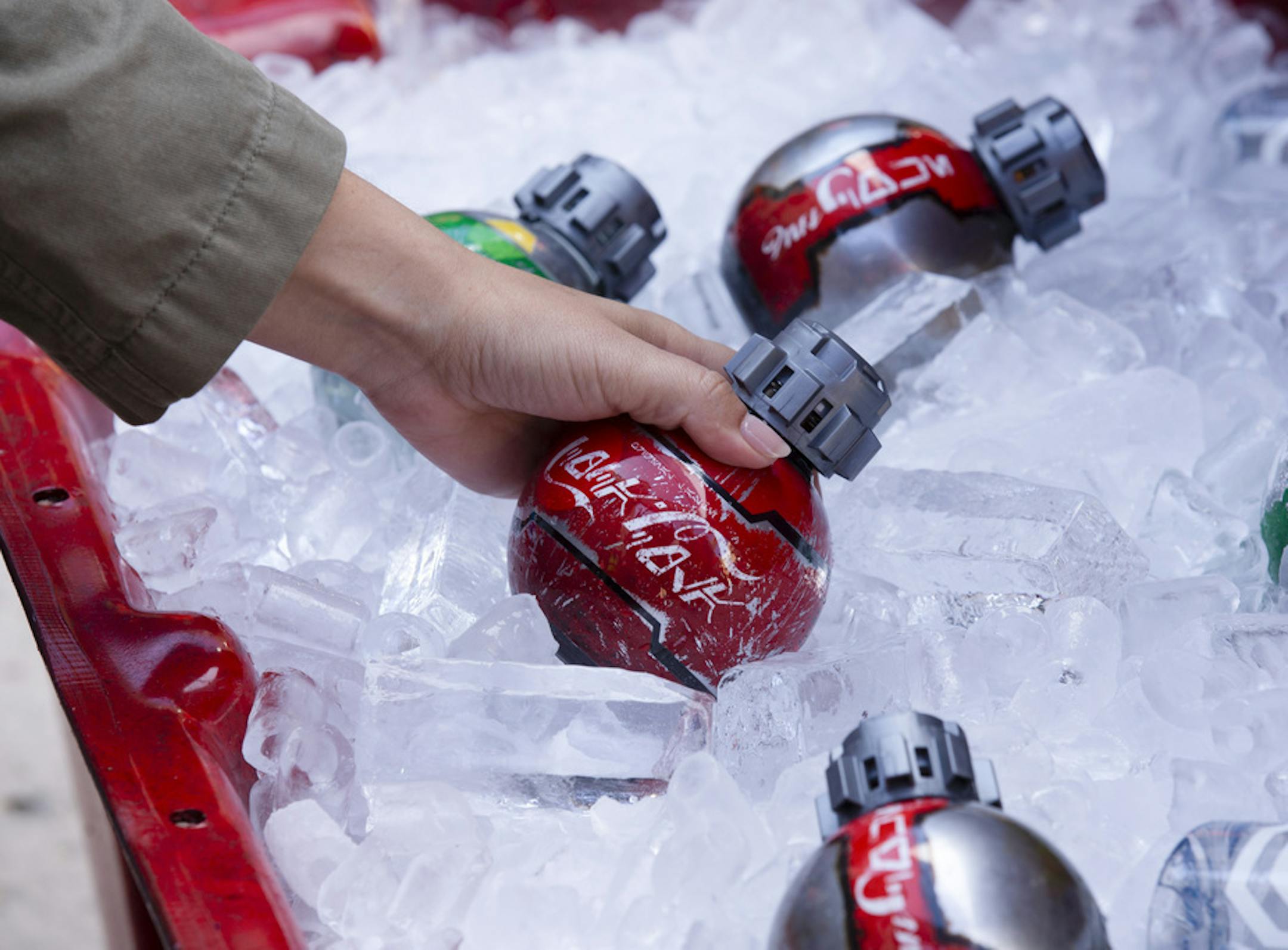In an undated photo from the Coca-Cola Company, "Star Wars"-themed bottles of Coke, Diet Coke and Sprite, available for purchase at Disney's "Star Wars: Galaxy's Edge" theme park sections. The Transportation Security Administration has had a change of heart after telling travelers that they could not fly with soft drink bottles shaped like the thermal detonators featured in ÒStar Wars.Ó (Coca-Cola Company via The New York Times) -- NO SALES; FOR EDITORIAL USE ONLY WITH NYT STORY TSA TH