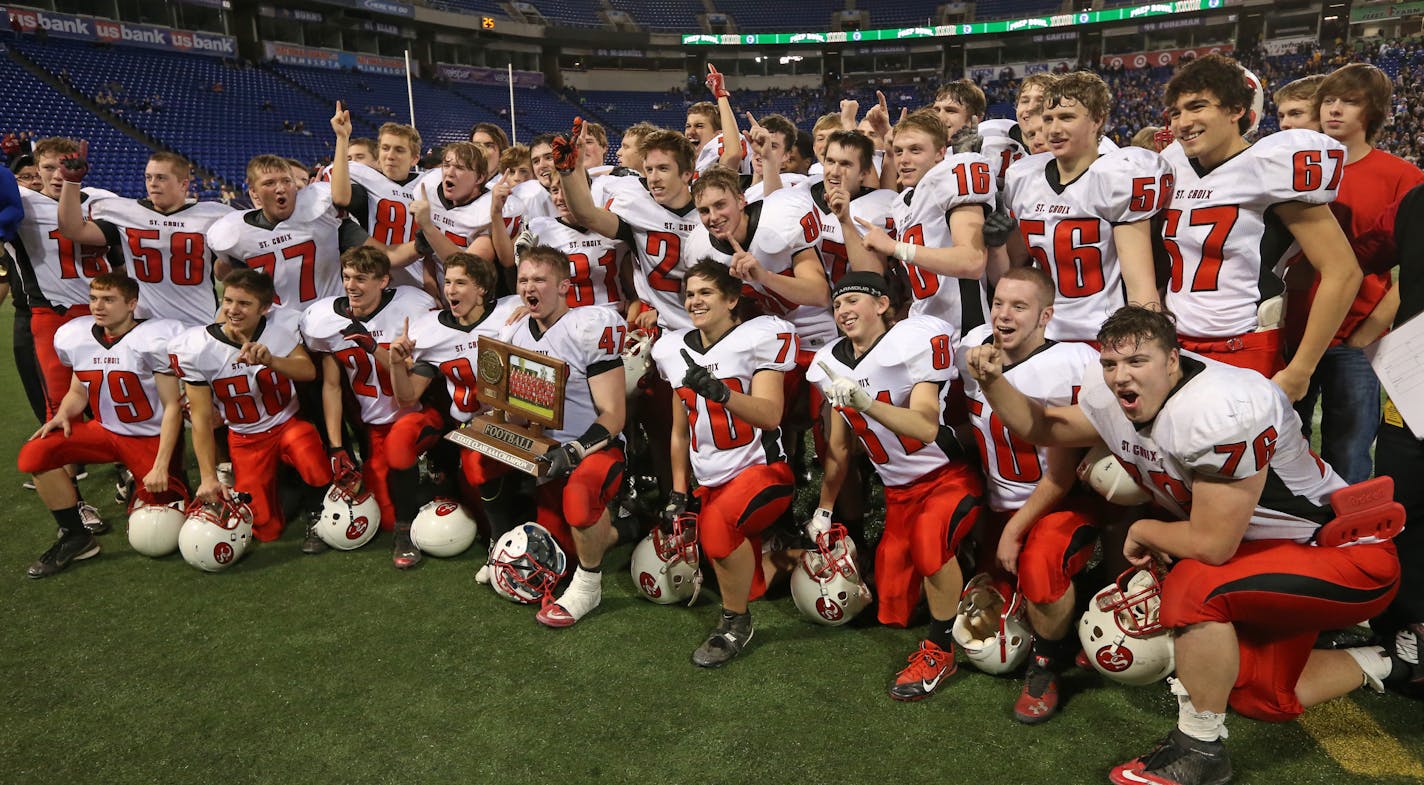 Minnesota State High School League Prep Bowl Championship Games, Metrodome, 11/30/13. St. Croix Lutheran vs. New London-Spicer, Class 3A Championship. (left to right) St. Croix Lutheran celebrated their championship win over New London-Spicer.] Bruce Bisping/Star Tribune bbisping@startribune.com