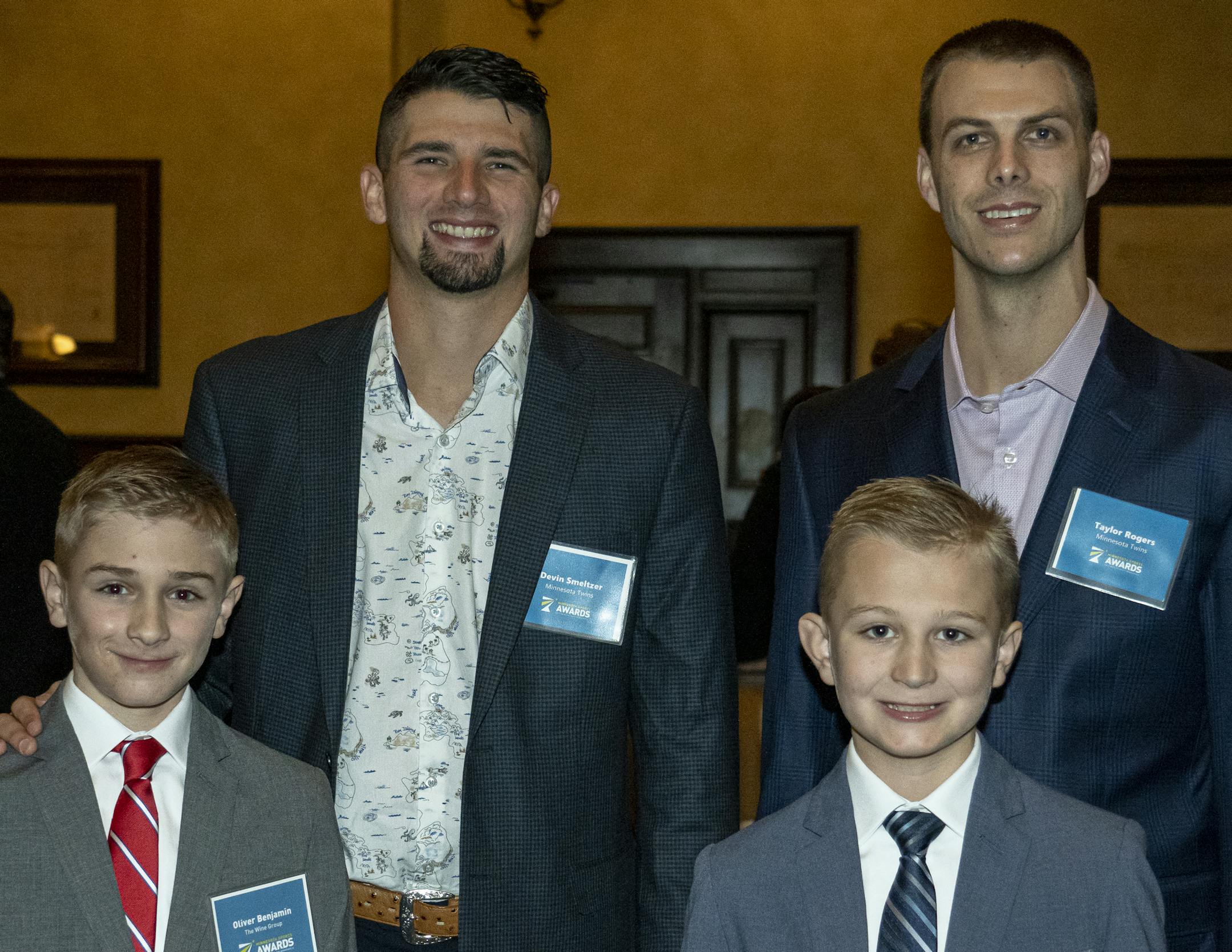Devin Smeltzer and Taylor Rogers, Oliver and Philip Benjamin at the 2019 Minneapolis Sports Awards. [ Special to Star Tribune, photo by Matt Blewett, Matte B Photography, matt@mattebphoto.com, Sports Minneapolis, Minneapolis Sports Awards, The Depot, United Heroes League, Dec. 11, 2019, Minneapolis, Minnesota, 1010220591 FACE010520 Oliver and Philip in the front