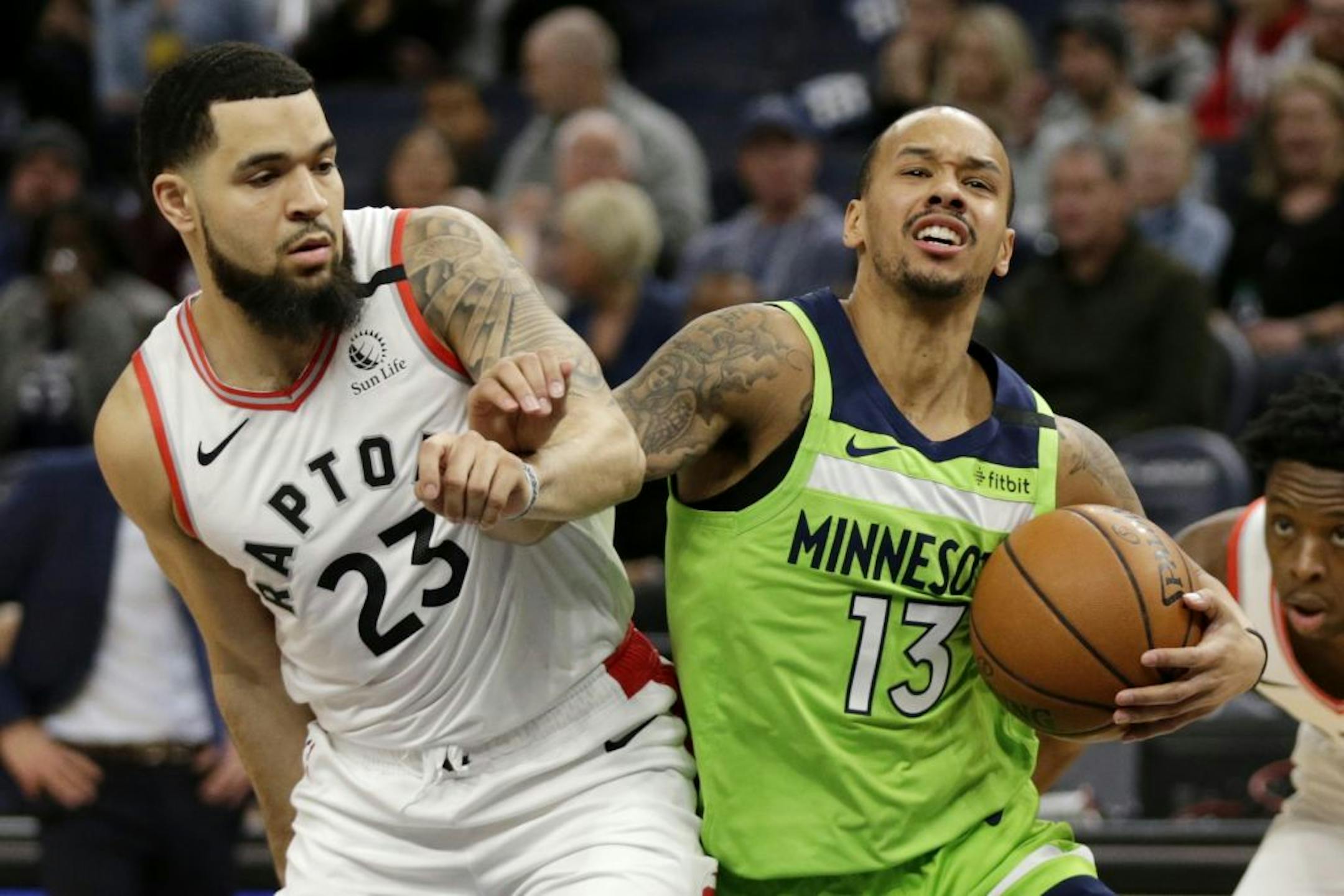 Minnesota Timberwolves guard Shabazz Napier (13) drives against Toronto Raptors guard Fred VanVleet (23) in the first quarter of an NBA basketball game Saturday, Jan. 18, 2020, in Minneapolis.