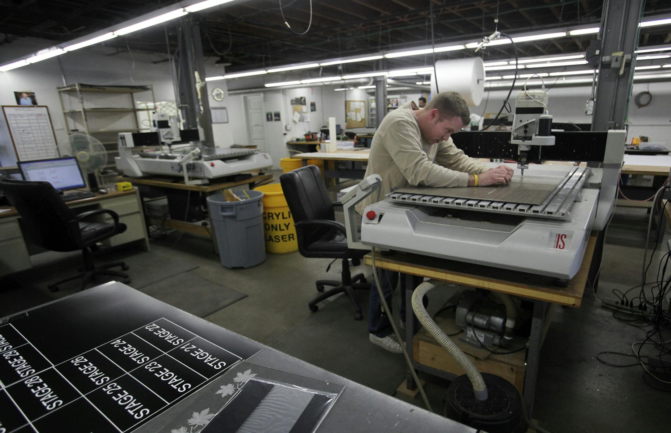 Accent Signage engraver Bill Sullivan works on filling a braille sign order at the company Tuesday, Feb. 19, 2013, in Minneapolis, MN. Rod Grandner, who currently heads the company, looks at Accent as much as a family as a business. "When we first got back together as a group it was pretty clear everybody pretty much had that same sentiment of carrying on and paying tribute to the people who were no longer with us,&#x201a;&#xc4;&#xf9; Grandner said recently in an interview.] (DAVID JOLES/STARTRI