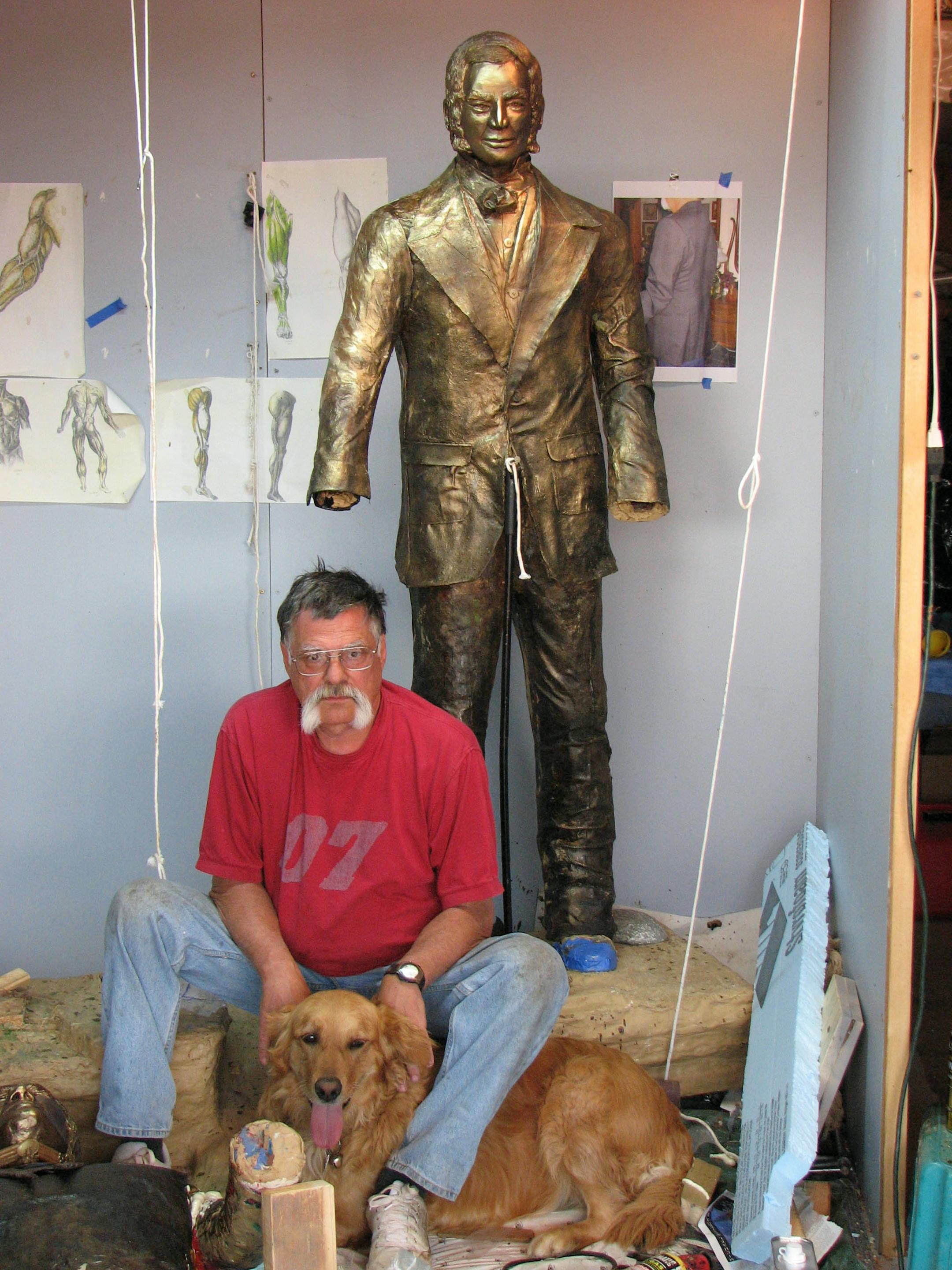 Bronze sculptor Bill Huber, a graduate of Shakopee High School, spent the last two years of his life creating the seven-foot statue of Chief Shakopee and Samuel Pond that was unveiled in the entryway of the new high school building last weekend. Here he is with one of the statues.