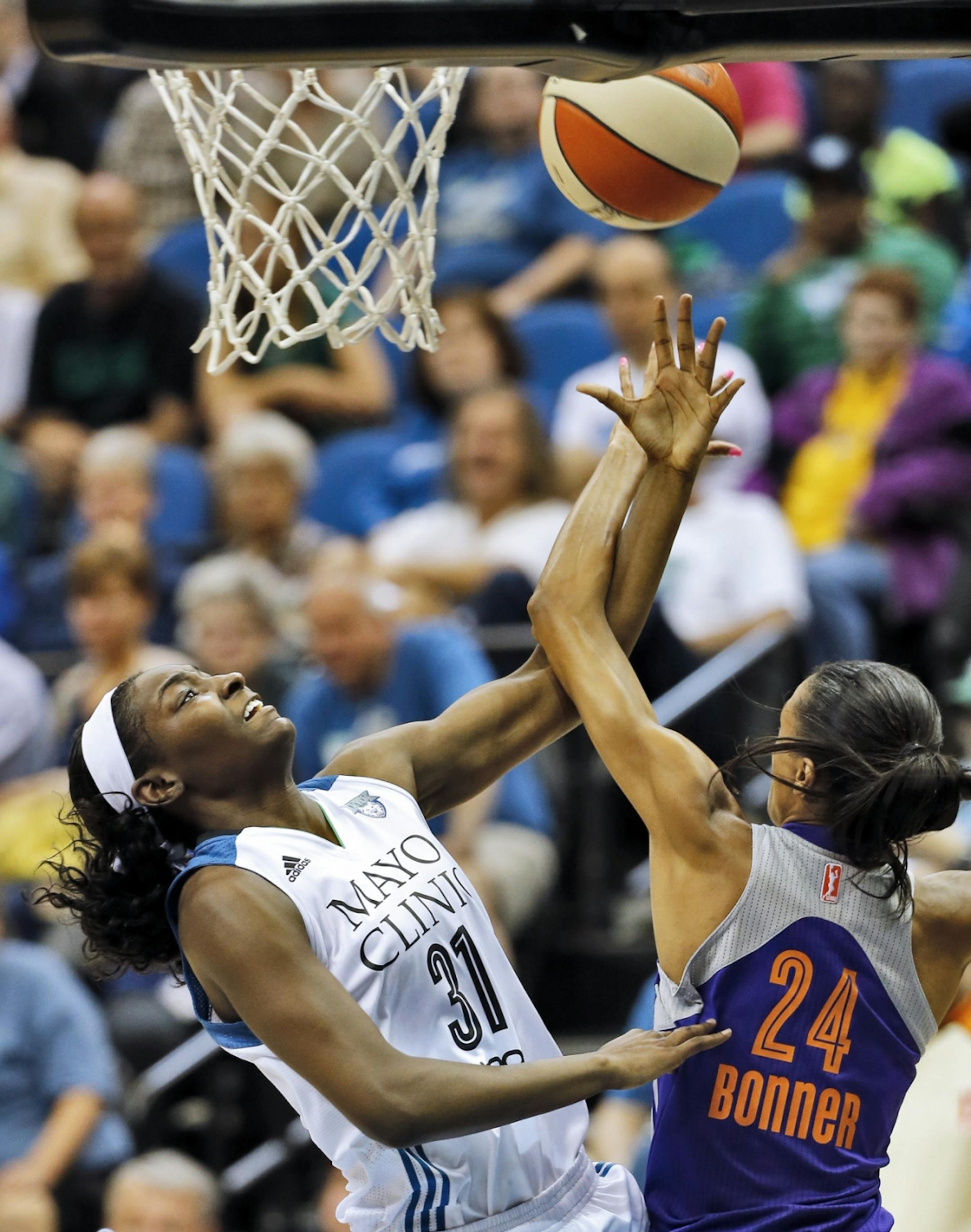 Lynx Asia Taylor (31) was fouled by Phoenix DeWanna Bonner as she drove to the basket.