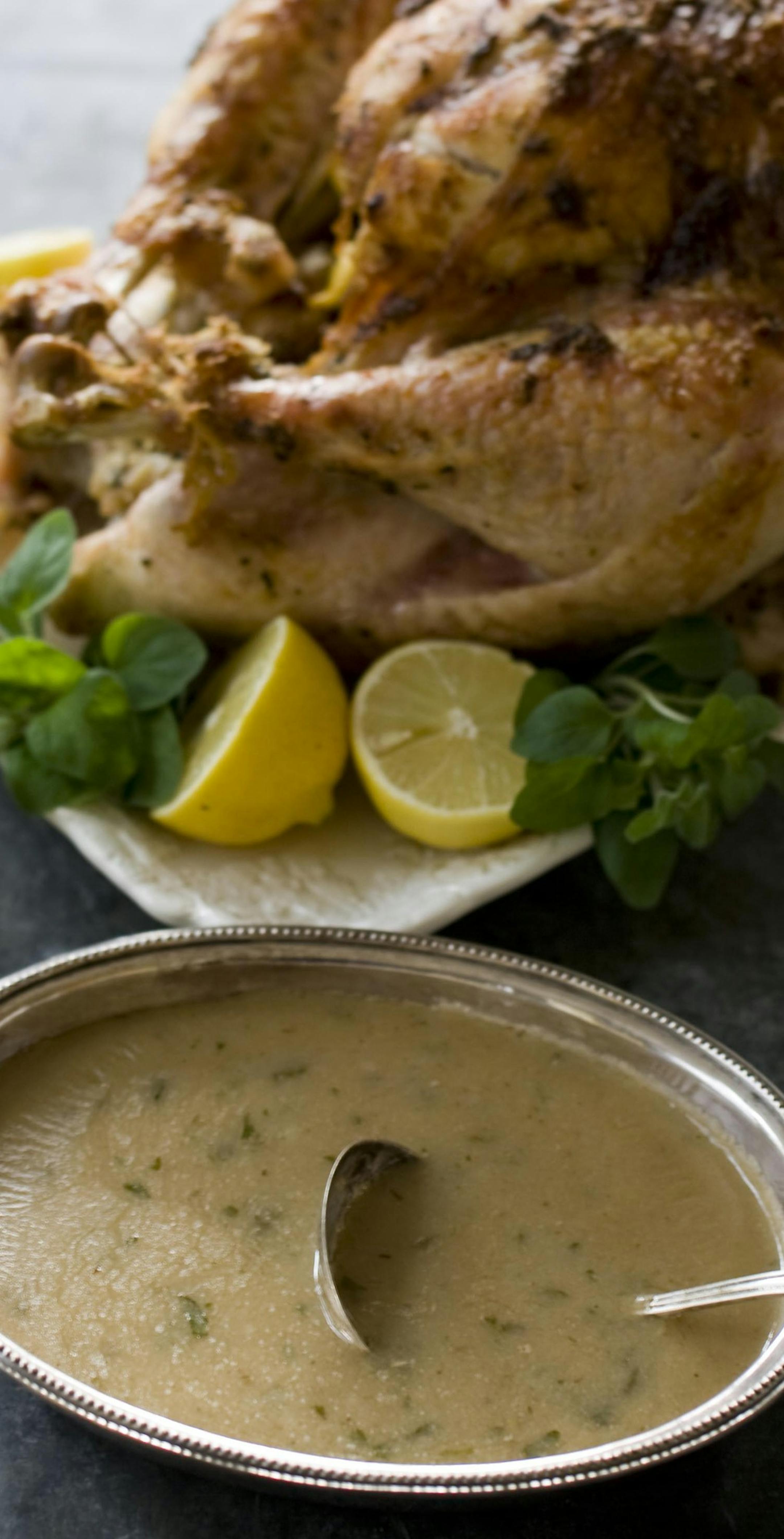 This Oct. 28, 2013 photo shows Asian-inspired modern turkey and gravy in Concord, N.H. Ginger, sesame oil and chives offer a different take to the traditional sage, citrus, rosemary and thyme flavors of a traditional turkey. (AP Photo/Matthew Mead)