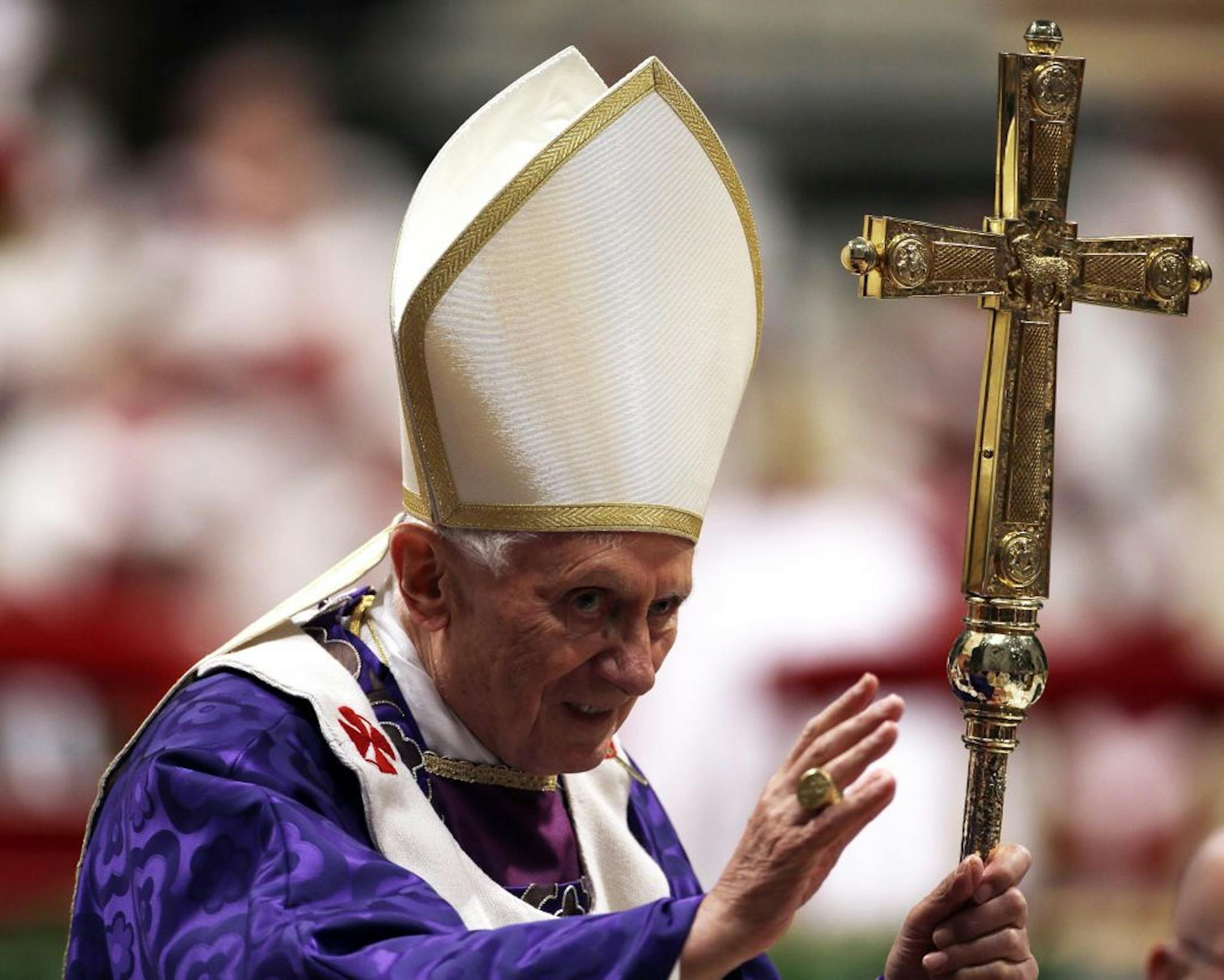 Pope Benedict XVI greets the faithful at the end of the Ash Wednesday mass in St. Peter's Basilica at the Vatican, Wednesday, Feb. 13, 2013. Ash Wednesday marks the beginning of Lent, a solemn period of 40 days of prayer and self-denial leading up to Easter. Pope Benedict XVI told thousands of faithful Wednesday that he was resigning for "the good of the church", an extraordinary scene of a pope explaining himself to his flock that unfolded in his first appearance since dropping the bombshell an