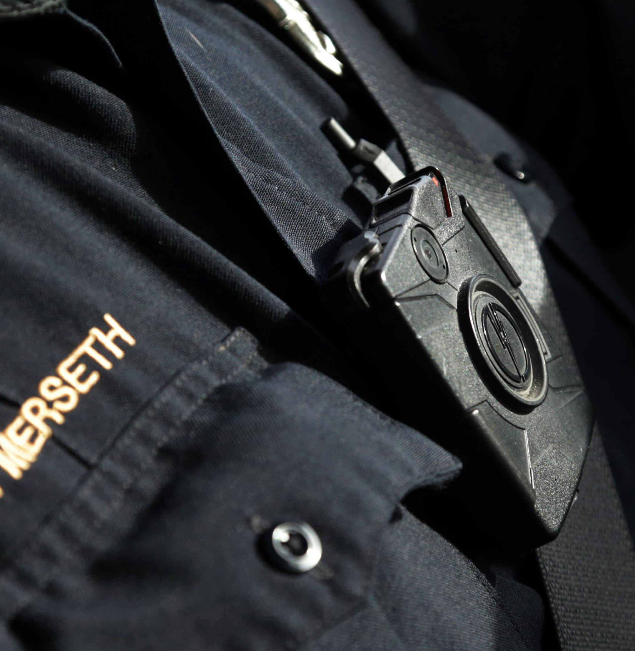 FILE - In this Feb. 2, 2015, file photo, Duluth police officer Dan Merseth patrols wearing his body camera in Duluth, Minn. Some Minnesota police chiefs plan to ask a state agency for temporary restrictions on access to police body camera video after failing to convince Minnesota lawmakers to limit public availability. (AP Photo/Jim Mone, File)
