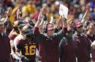 Coach Jerry Kill, players and coaches celebrate a touchdown at TCF Bank Stadium.