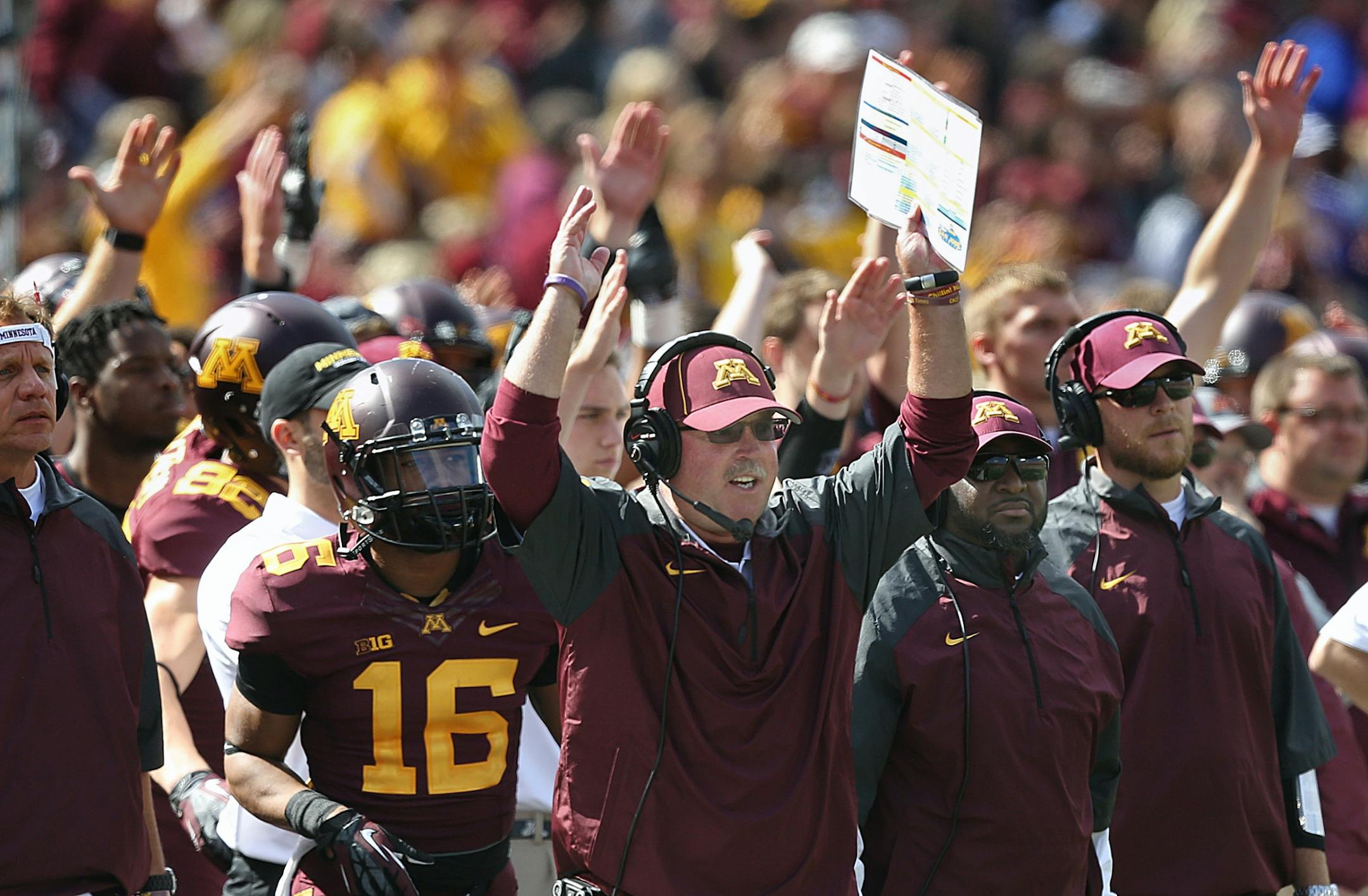 Coach Jerry Kill, players and coaches celebrate a touchdown at TCF Bank Stadium.