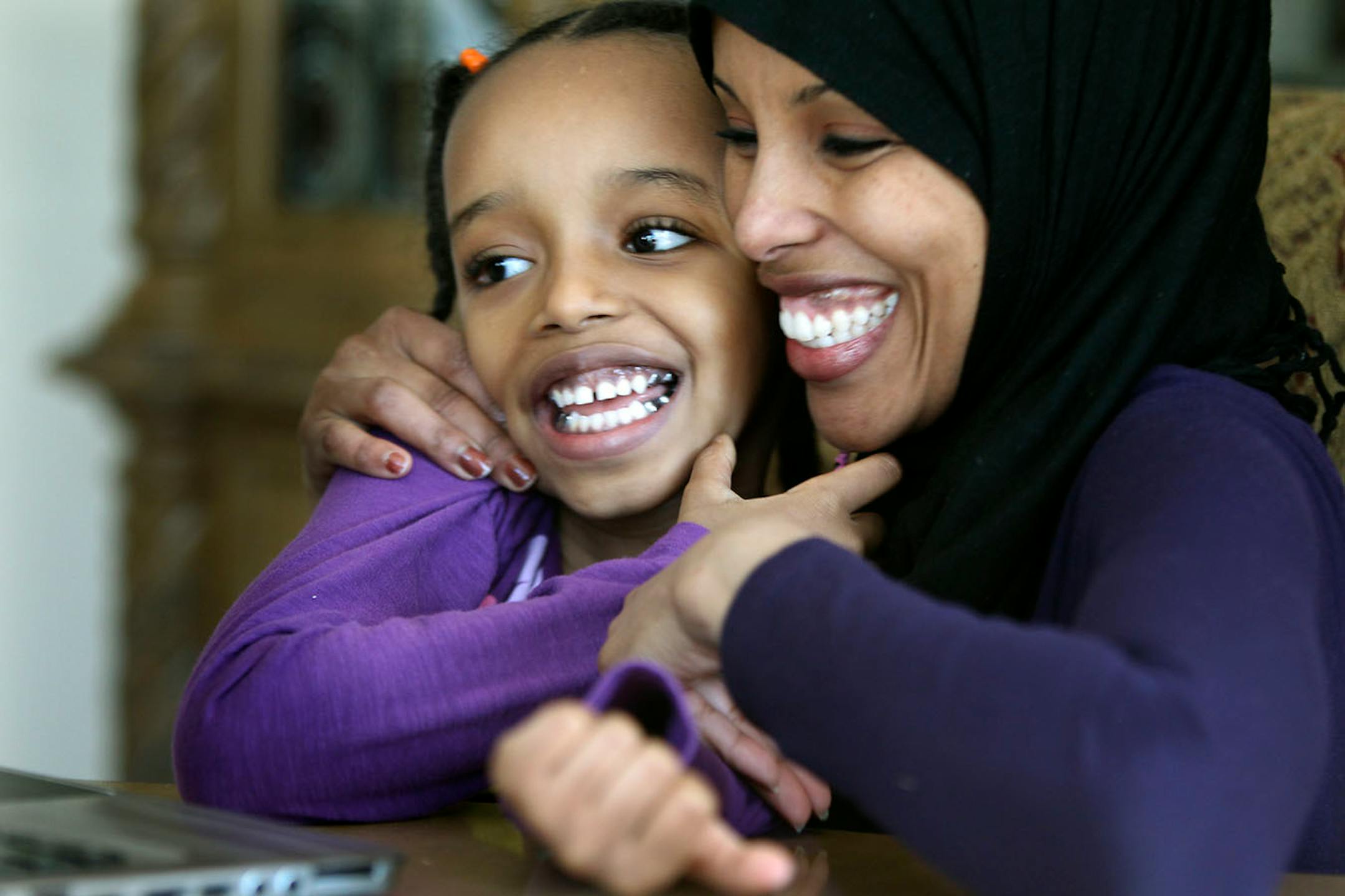 Hodan Hassan worked on a computer game with her daughter Geni Hassan, 6. Hassan said Geni spent more than four years in therapy. Hassan knows why some in the Minneapolis Somali community have feared vaccines. As the mother of an autistic child, she once believed there might be a link between vaccines and her daughter's condition. But no more. Hassan is scheduled to speak at a Somali community forum on Saturday, to encourage fellow parents to get their kids vaccinated in the face of an escalating