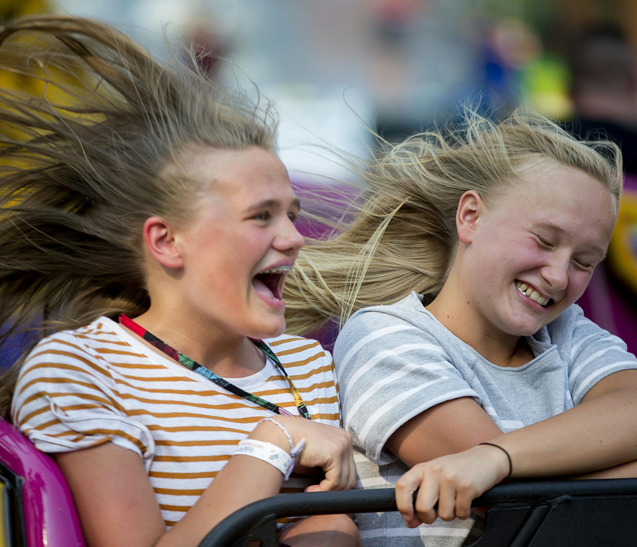 (From left) Jana Impola and Kaitlyn Kangas laugh and scream as they ride Delano's version of the scrambler. ] ALEX KORMANN • alex.kormann@startribune.com Delano, MN hosts the oldest Fourth of July celebration in the state. Thousands of people turn out to partake in the festivities. The night of Jul 3rd consists of carnival games and rides along with performers and singers. Thousands of people of all ages flood in from around the state dressed in red, white and blue for an evening of fun.
