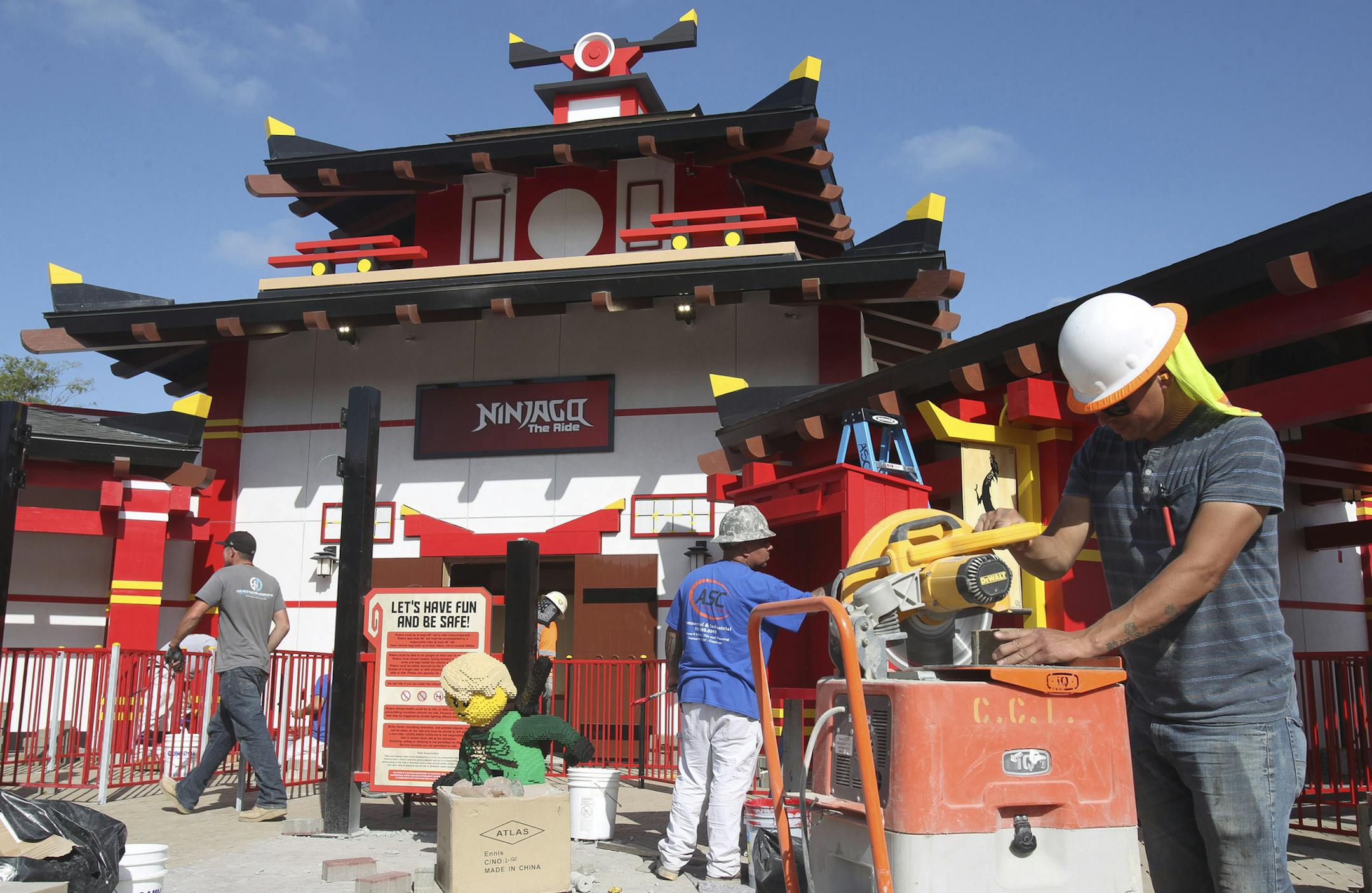 Construction crews work to finish the new Lego Ninjago attraction at Legoland on April 27, 2016 in Carlsbad, Calif. (Hayne Palmour IV/San Diego Union-Tribune/TNS)