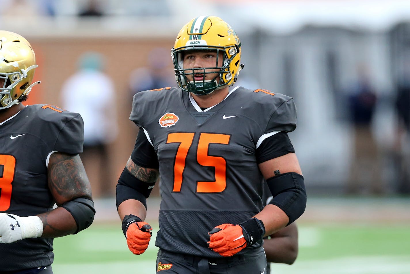 FILE - National Team offensive lineman Dillon Radunz of North Dakota State&nbsp;is shown during the second half of the NCAA college football Senior Bowl in Mobile, Ala, in this Saturday, Jan. 30, 2021, file photo. There's a common thread linking most of the Football Championship Subdivision players who expect to hear their name called in this month's NFL draft. They didn't participate in their schools' pandemic-delayed spring season. (AP Photo/Rusty Costanza, File)