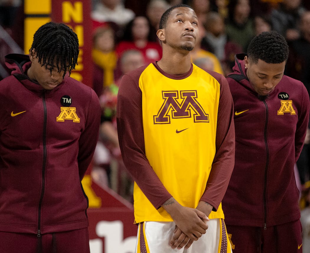 Gophers guard Dupree McBrayer looked up after a moment of silence to honor his mother Tayra McFarlane who died Monday.
