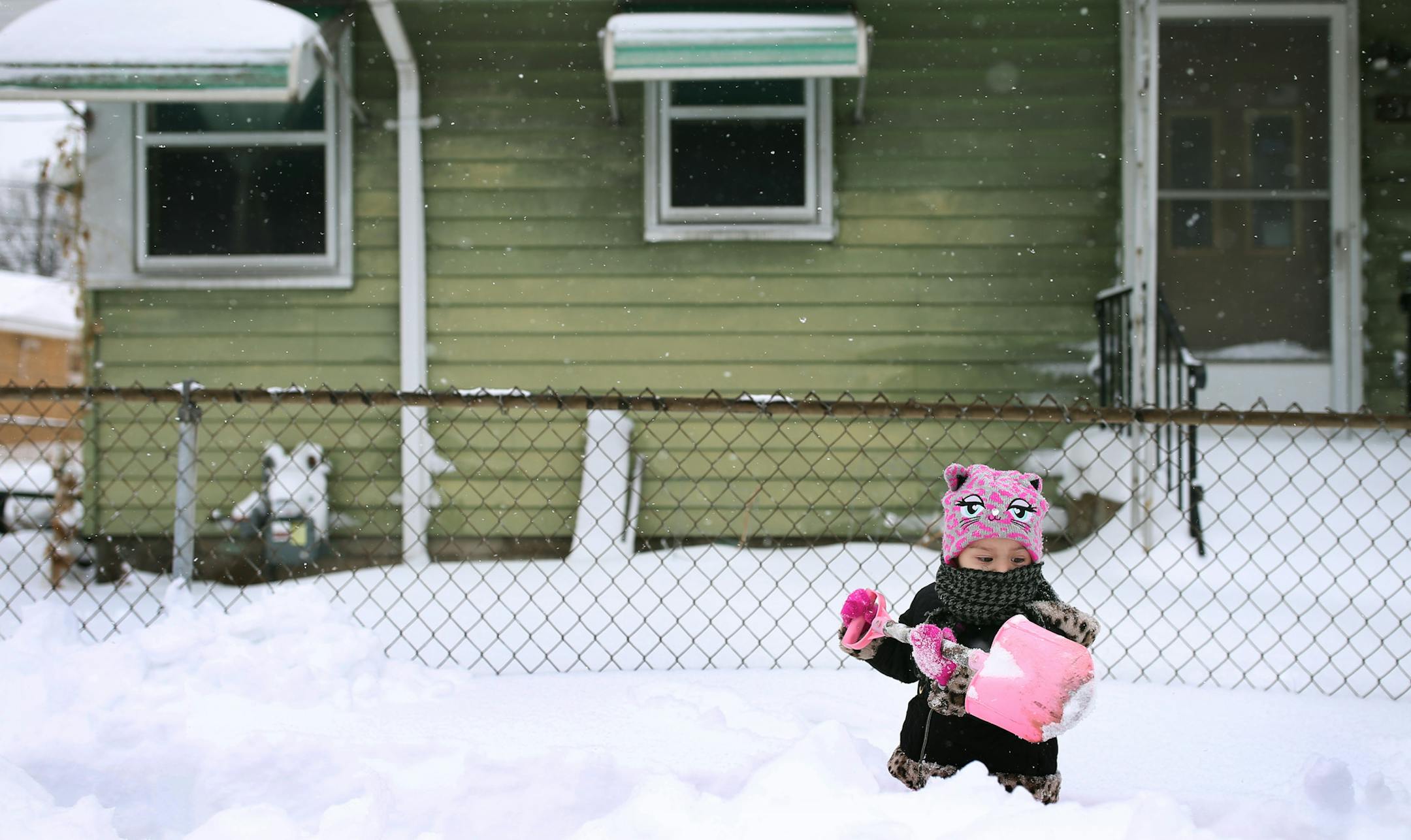 Roselyn Silvestre 2, helped shovel snow in front of her home along Penn Avenue after a Minneapolis blizzard in April 2018. JERRY HOLT • jerry.holt@startribune.com ORG XMIT: MIN1812271201540013
