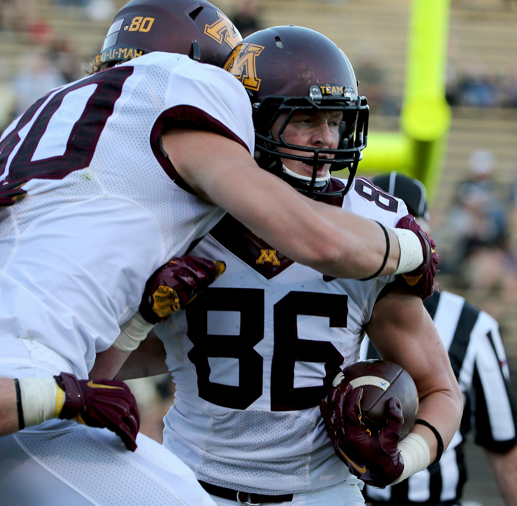 Minnesota Golden Gophers tight end Brandon Lingen (86) celebrated with Minnesota Golden Gophers tight end Nate Wozniak (80) after Lingen scored a touchdown during third quarter. ] (LEILA NAVIDI/STAR TRIBUNE) leila.navidi@startribune.com Gophers vs Purdue at Ross-Ade Stadium in West Lafayette., Saturday October 10, 2015.