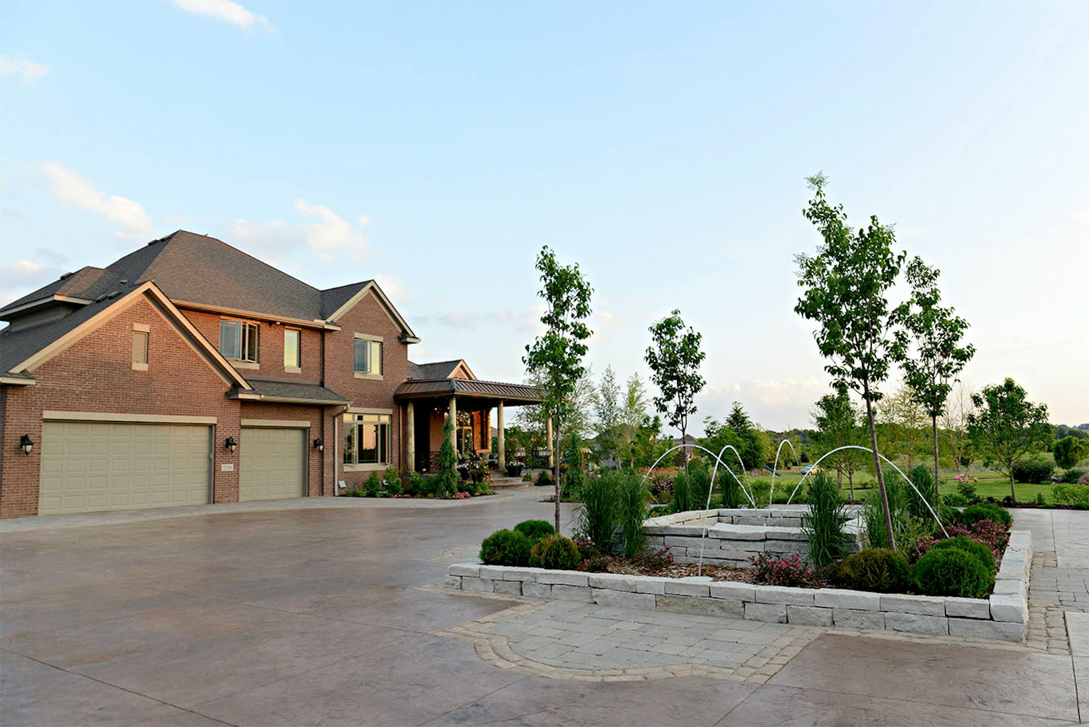 A new driveway creates a turn-around, making it easier for guests to come and go, and a fountain.