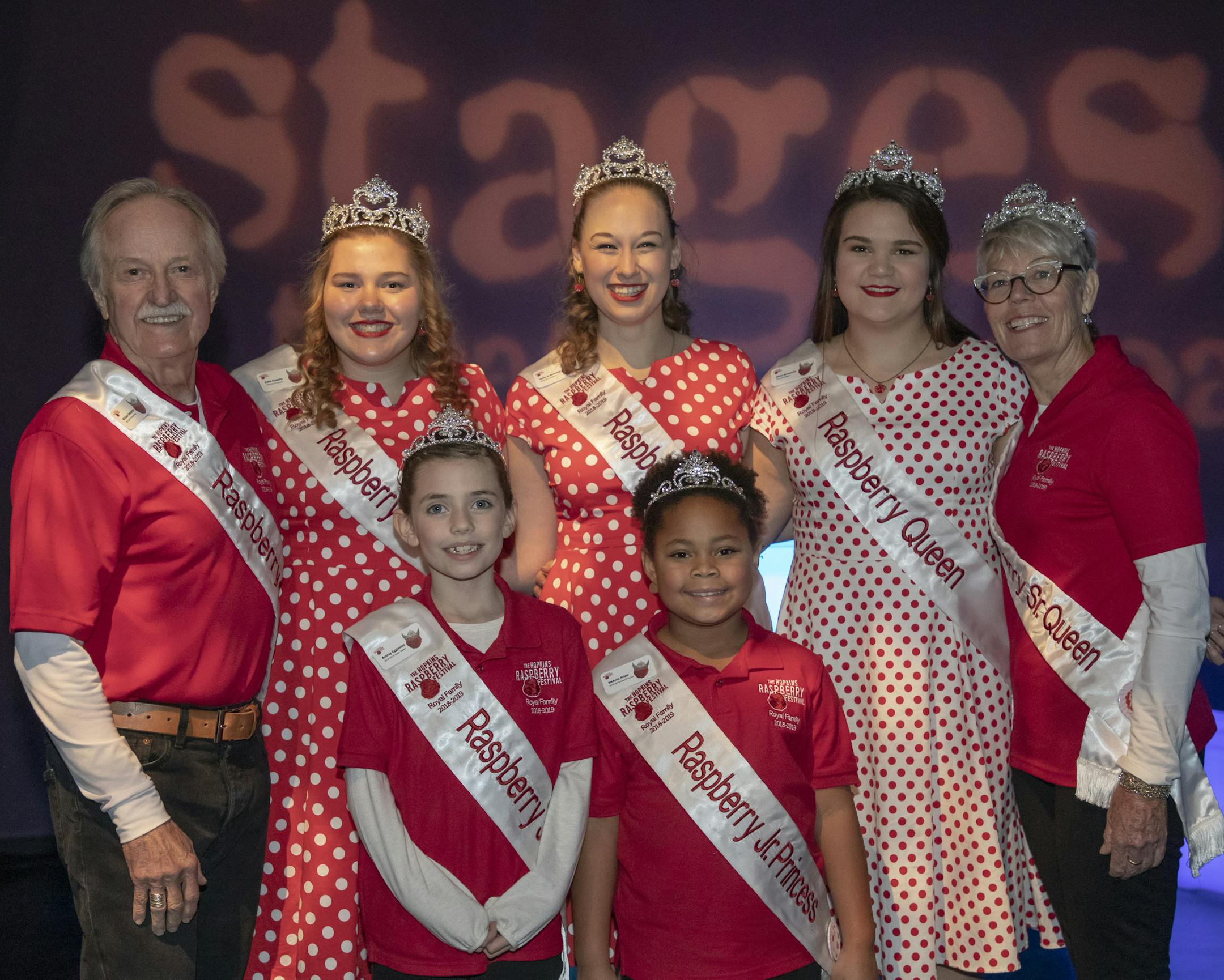 Hopkins Raspberry Festival royalty: Back, King William Steacker, Princesses Kallie Jo Ascheman and Katie Costello, Queen Ashley Normandin and Senior Queen Robin Price. Front, Junior Queen Aubrey Eggleston and Junior Princess MeAyila Priere.