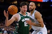 Bucks forward Danilo Gallinari works around Timberwolves forward Kyle Anderson during the first half Friday at Target Center.