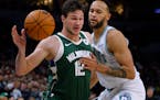 Bucks forward Danilo Gallinari works around Timberwolves forward Kyle Anderson during the first half Friday at Target Center.