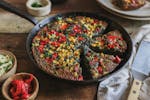 Peppers and corn add colorful touches to Blue Cornbread, an easy flourless cornbread. Recipe by Beth Dooley, photo by Ashley Moyna Schwickert, Special