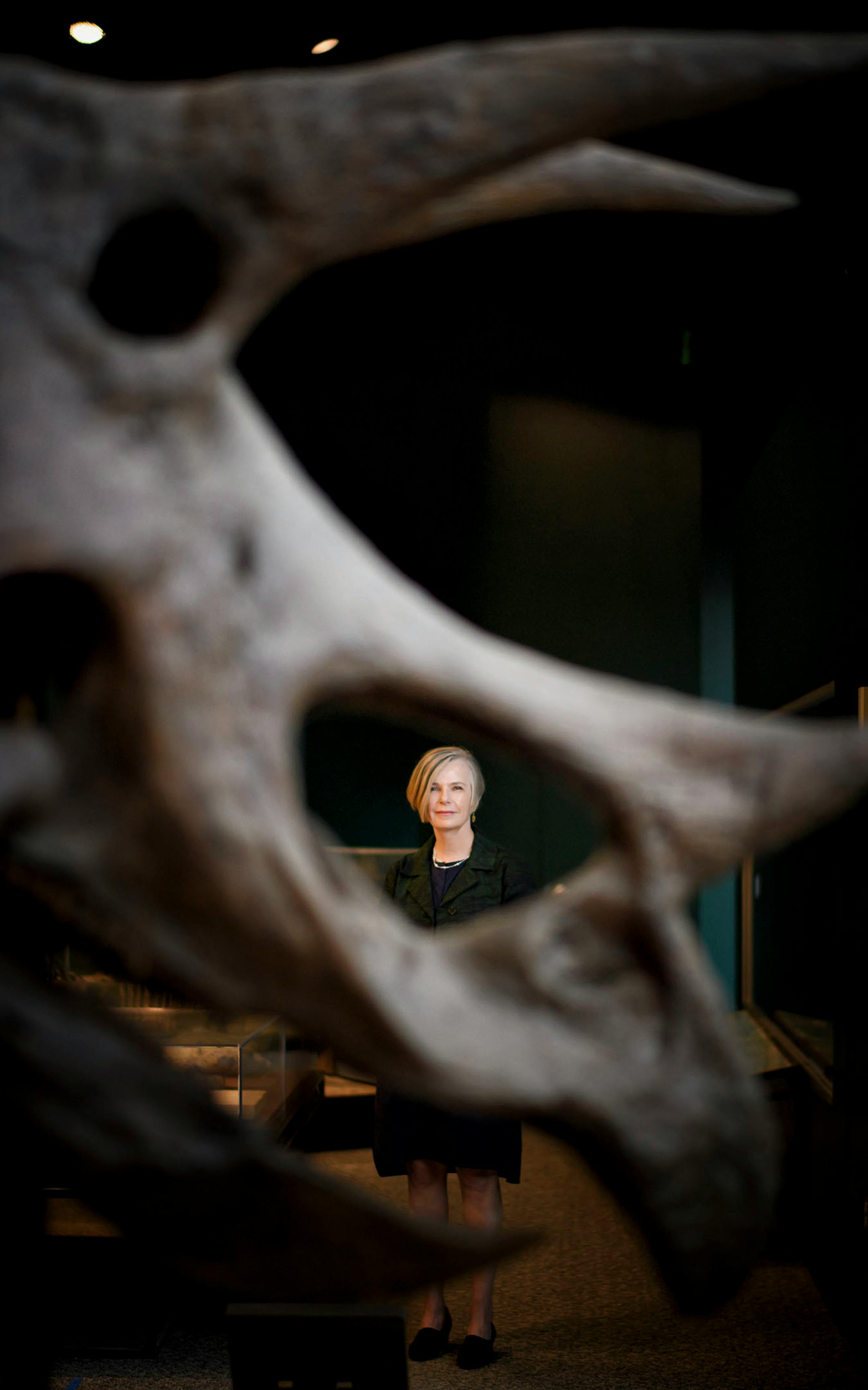 Alison Rempel Brown, the new president and CEO of the Science Museum of Minnesota, with the museum's Triceratops.