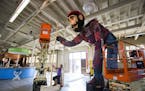 Jeanne Giernet of the Minnesota Pollution Control Agency worked on the Paul Bunyan exhibit before its 2016 State Fair debut. Paul Bunyan, dressed in c