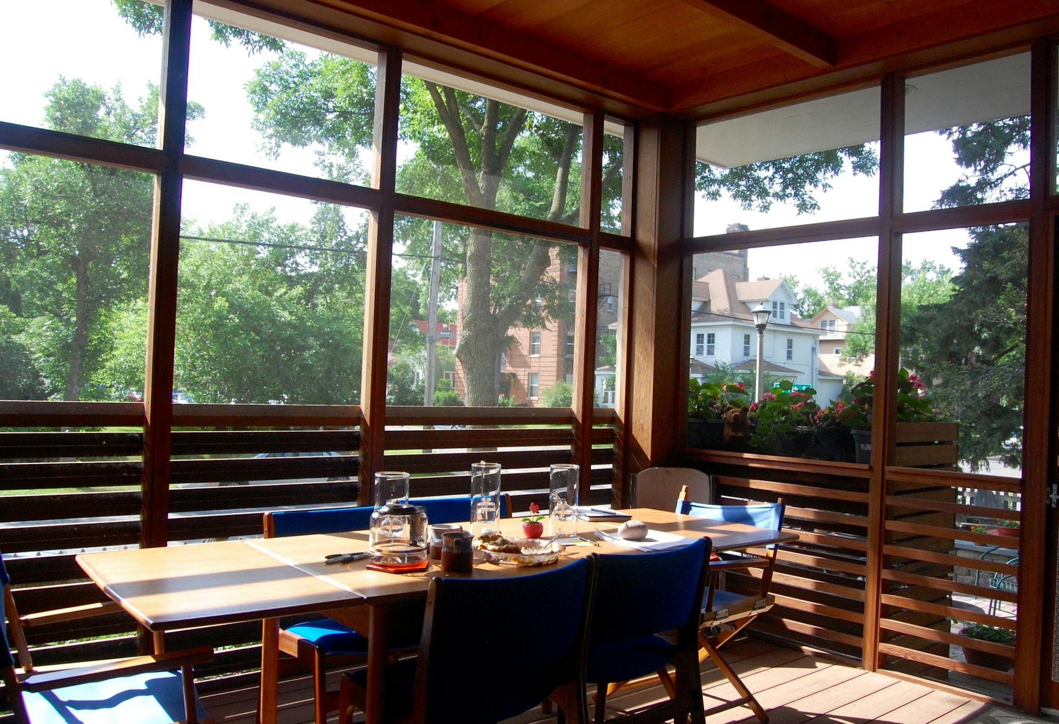 Meals are more private thanks to the reclaimed redwood slats across the porch.