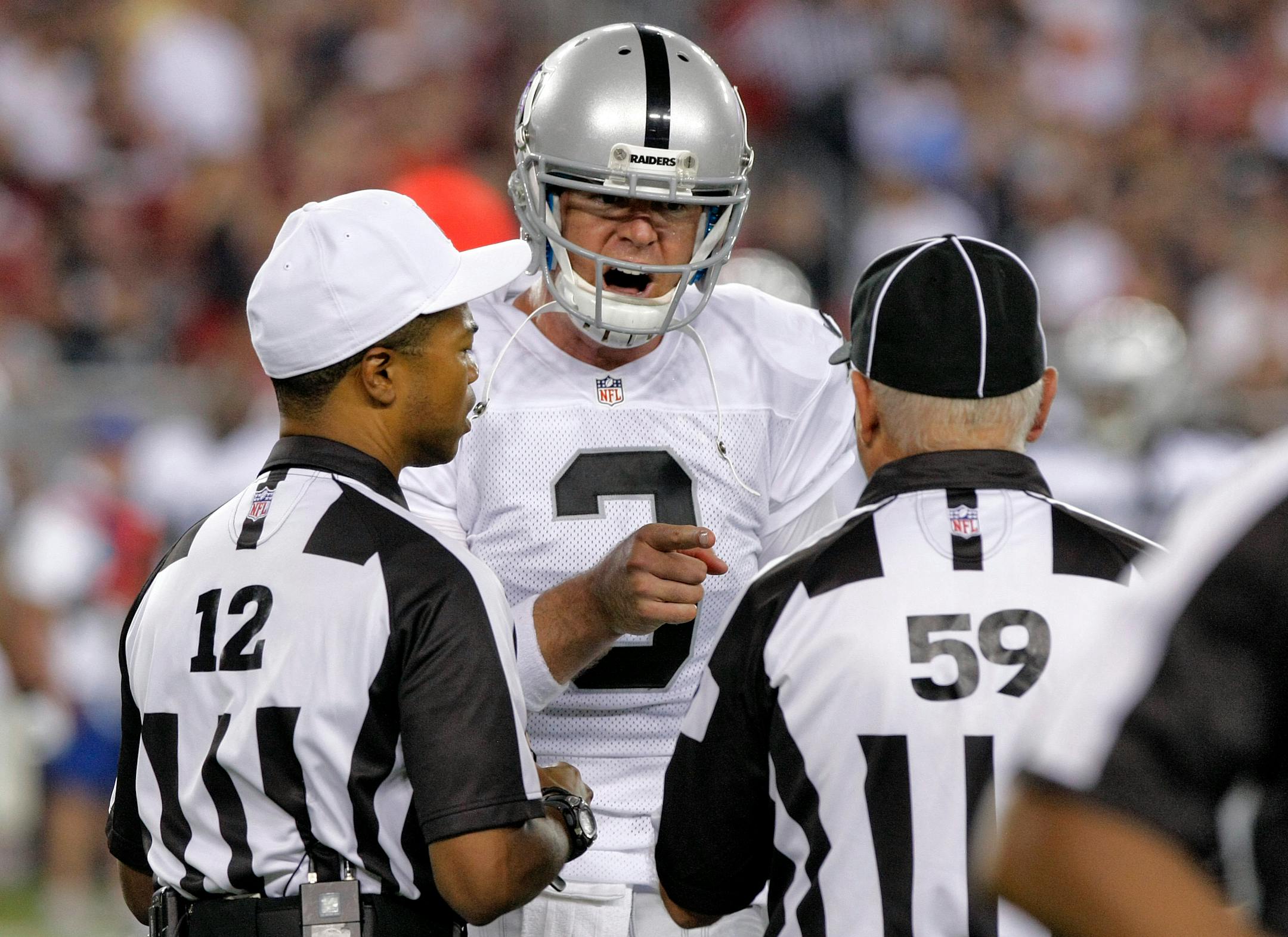 Raiders quarterback Carson Palmer argued with the replacement officials during the first half of a preseason game last season