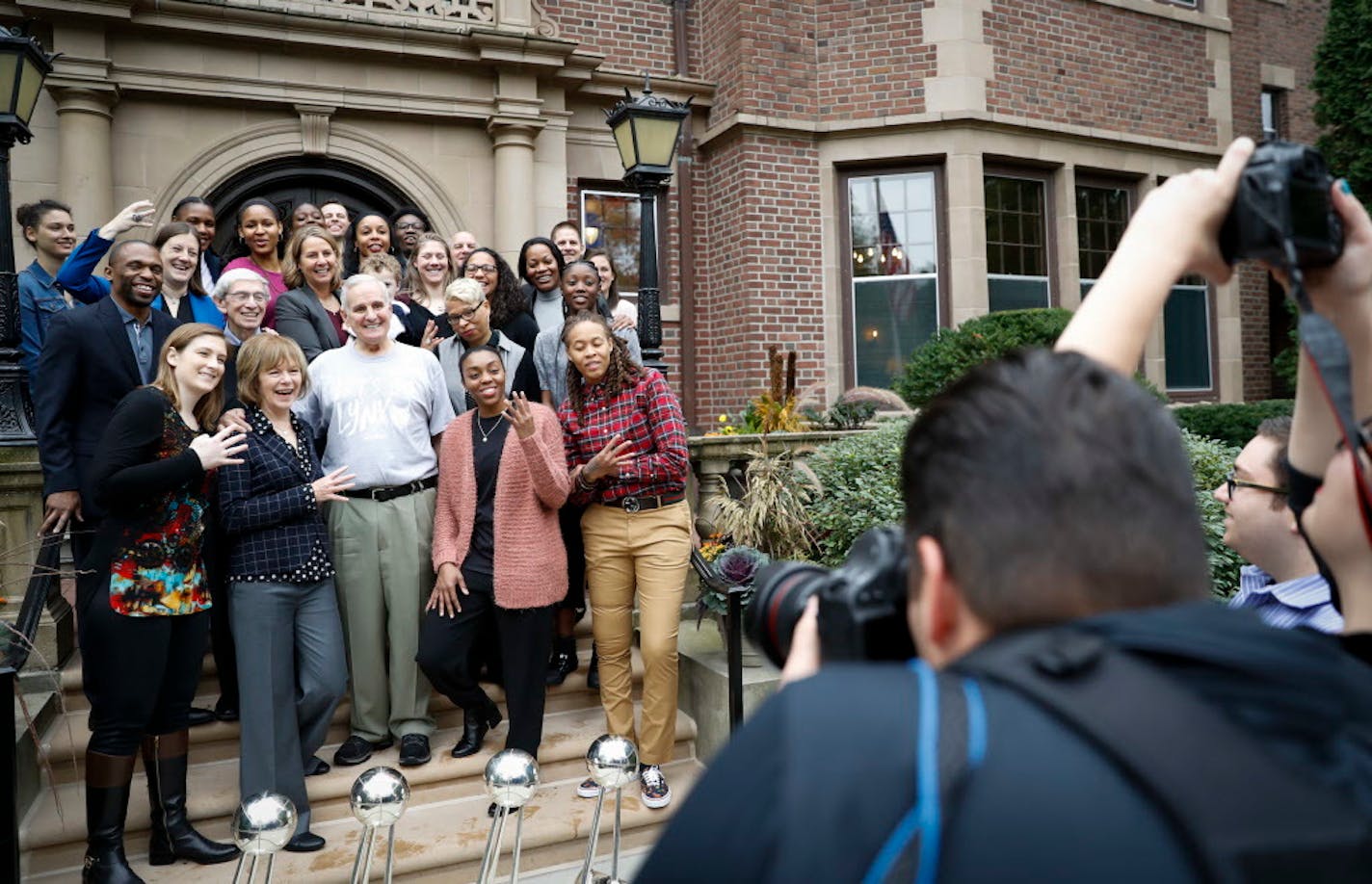 Lynx players and staff flashed four fingers for their four championship wins as they posed with Gov. Mark Dayton and Lt. Gov. Tina Smith in front of the Governor's mansion after a celebratory reception in St. Paul, Minn. on Friday, Oct. 6, 2017.