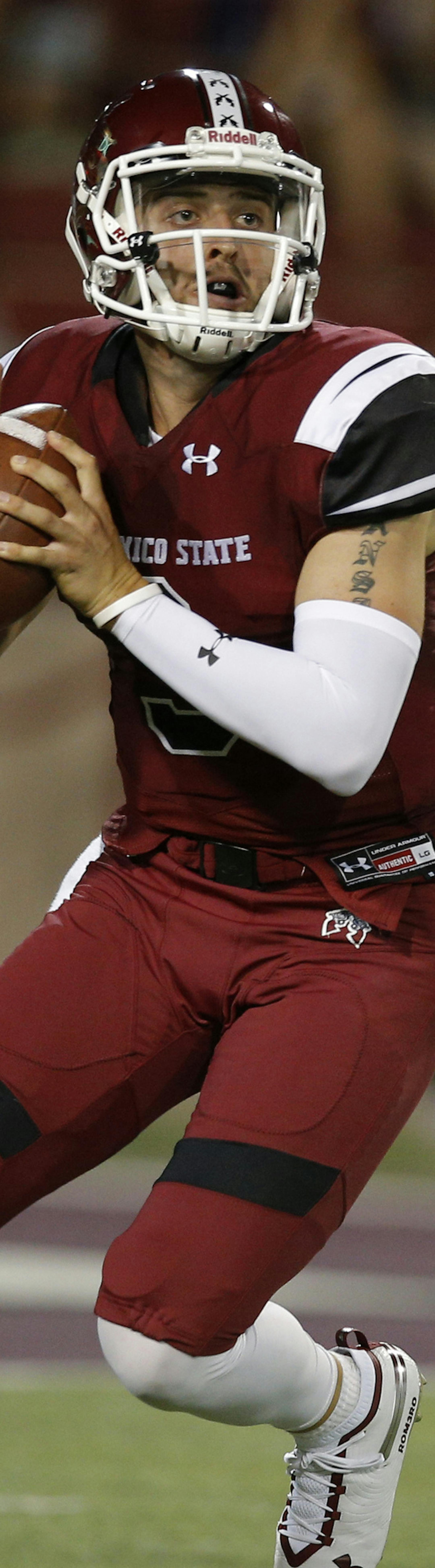 New Mexico State quarterback Matt Romero looks for a receiver during the first half of the team's NCAA college football game against Wyoming in Las Cruces, N.M., Saturday, Aug. 25, 2018. (AP Photo/Andres Leighton)